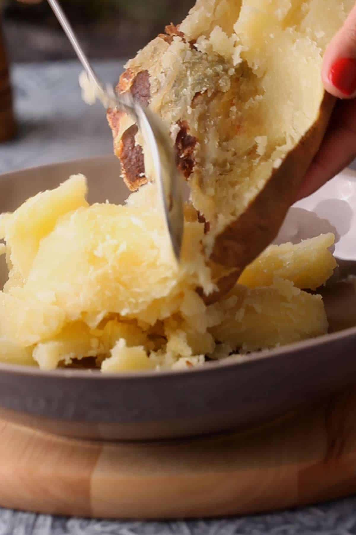 Scoop Baked Potatoes in a large bowl.
