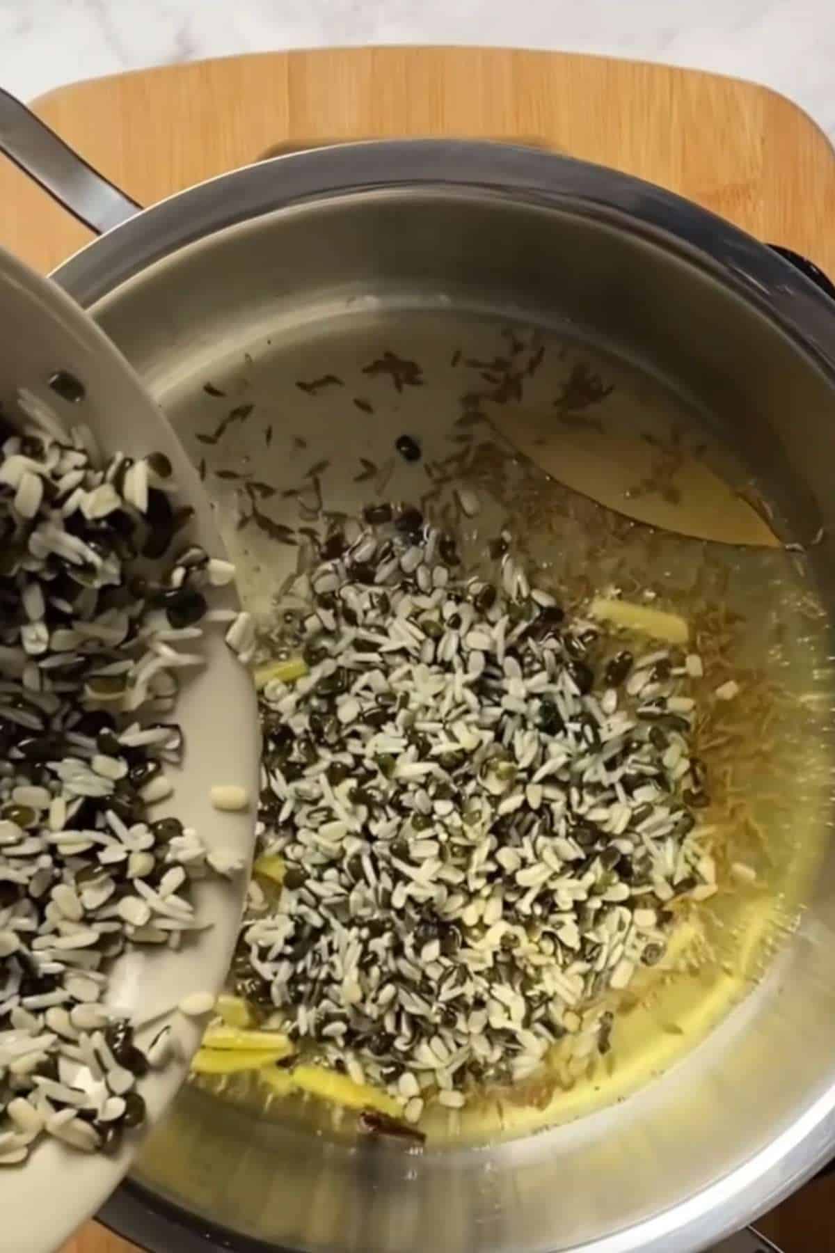 Add the soaked lentils and rice.