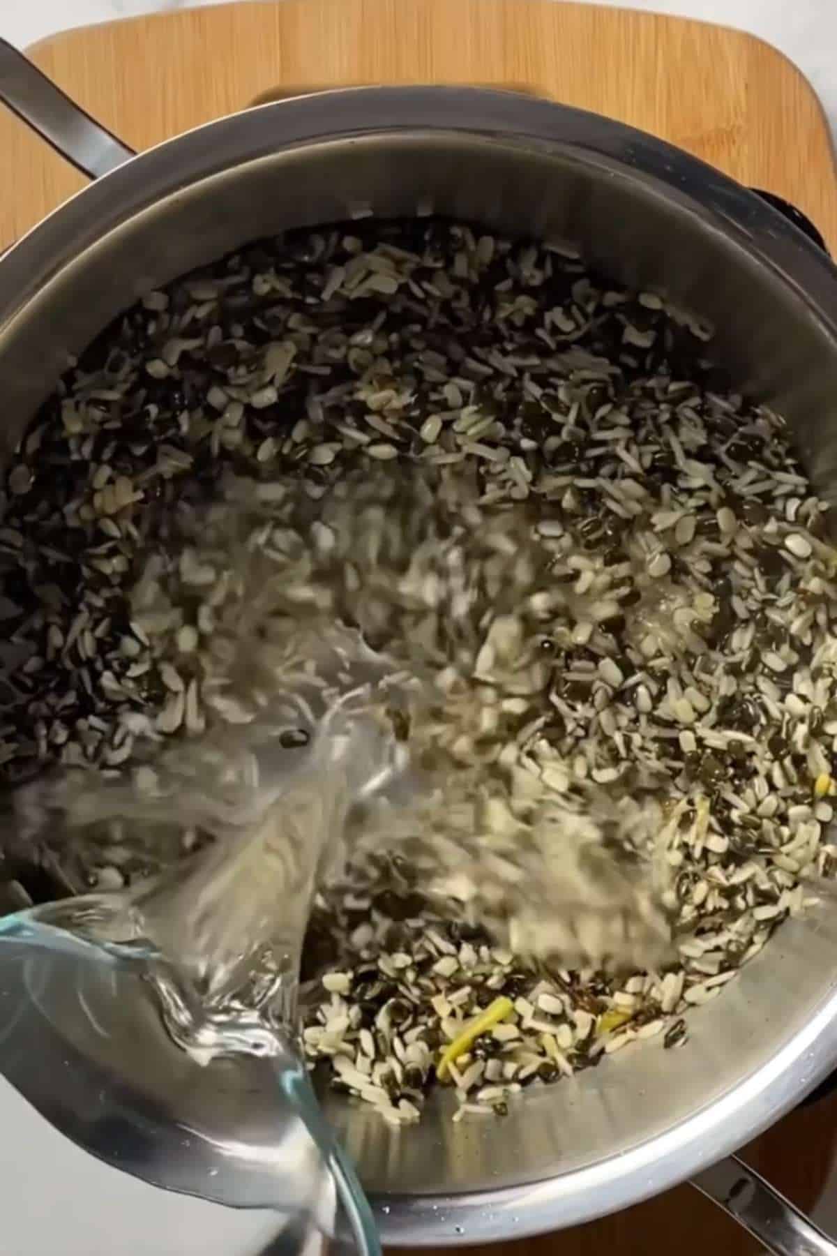 Add water to the khichdi.