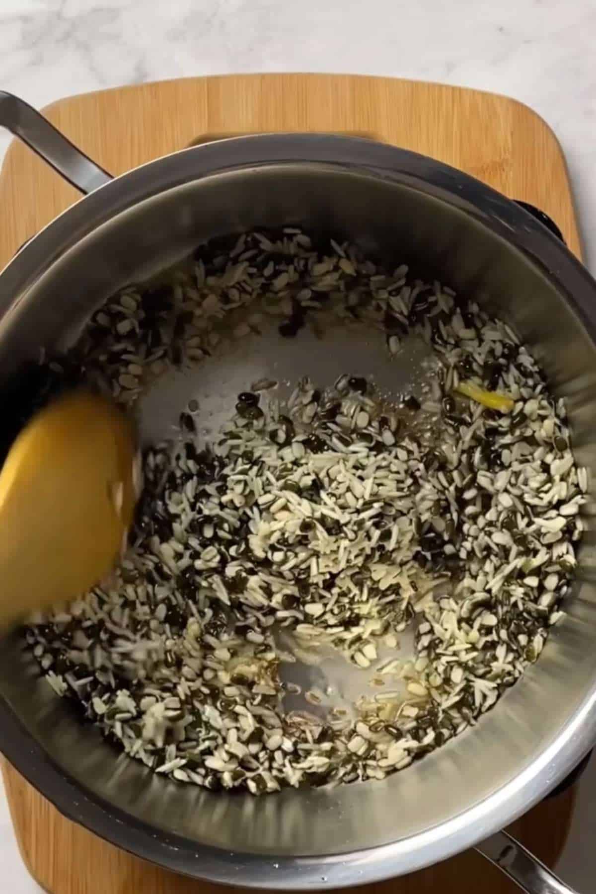 Saute rice and lentils in ghee and spices.