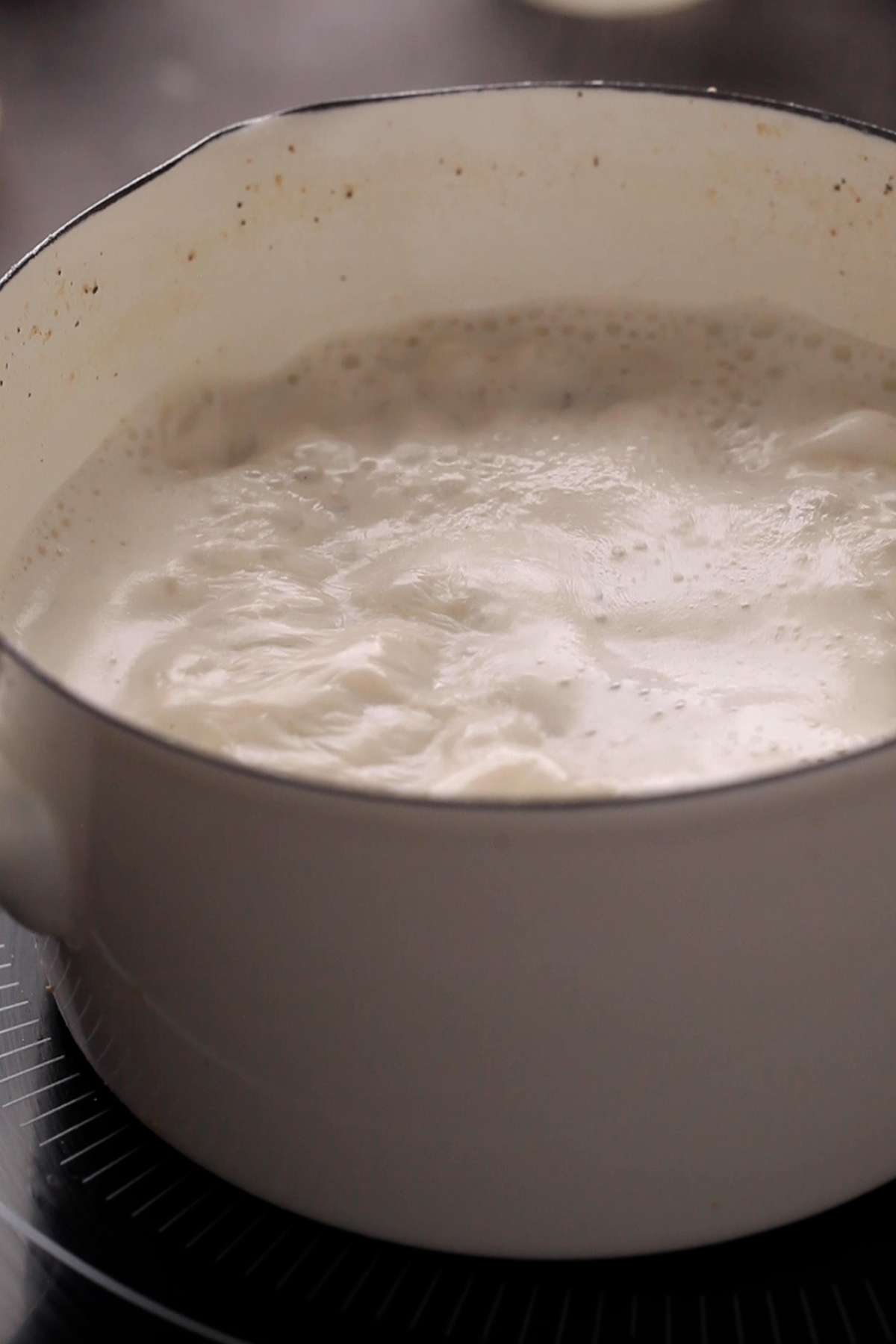 Boiling badam milk on low heat.