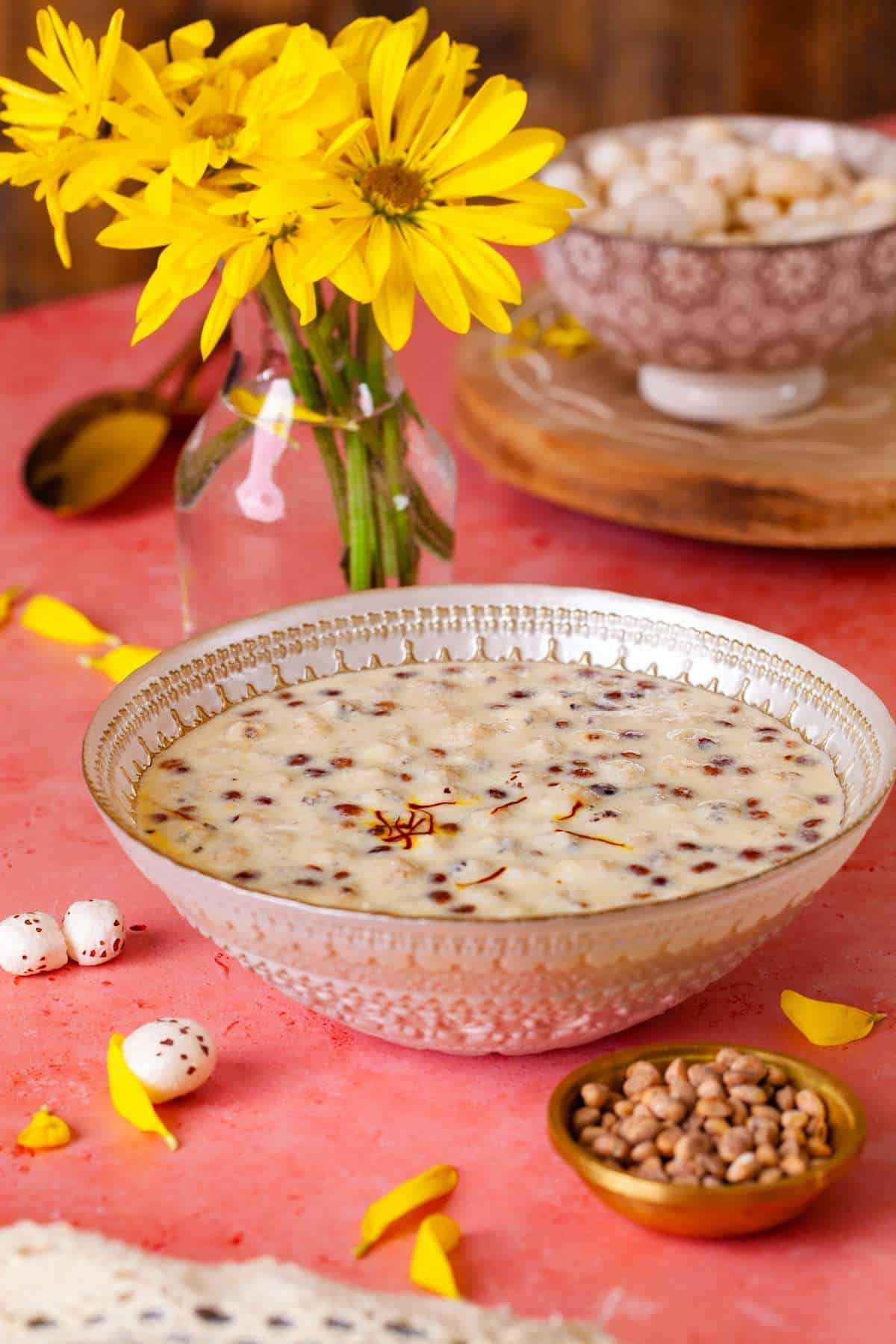 Side view of makhana kheer in a beige glass bowl.