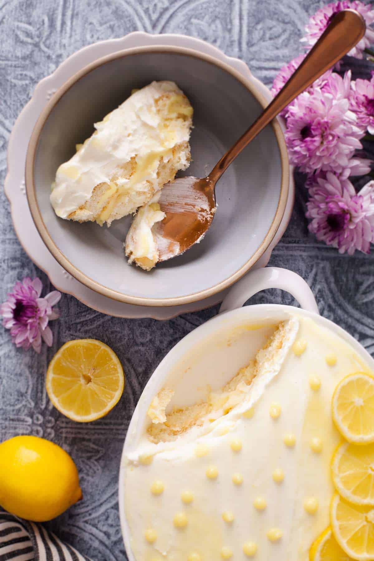 Lemon Tiramisu scooped in a grey bowl.