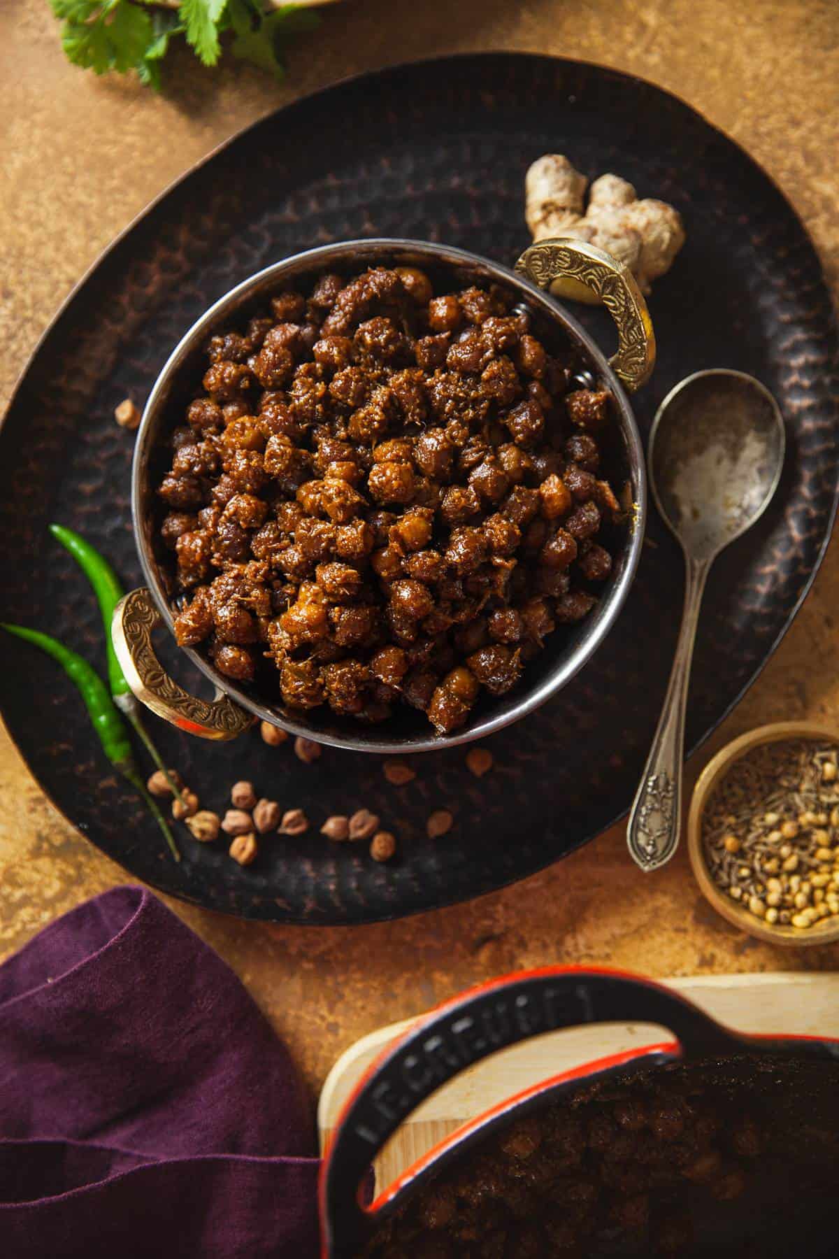 Dry Chana served in a steel kadai. 