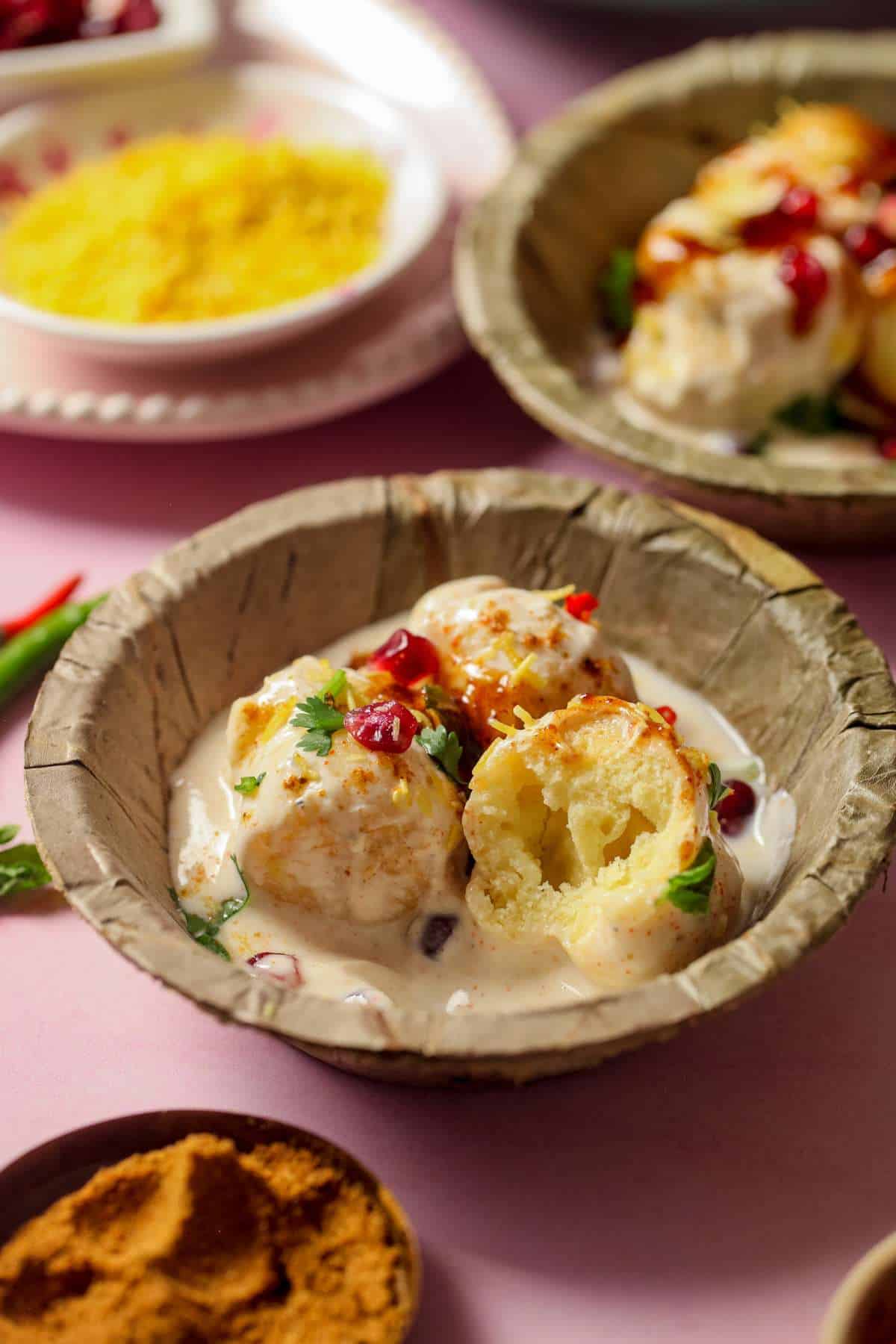 Shot of soft and spongy inside of a dahi vada made with moong dal.