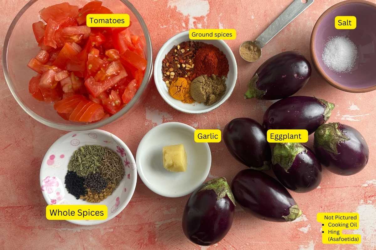 Ingredints Needed for Making Achari Baingan on a textured orange background.