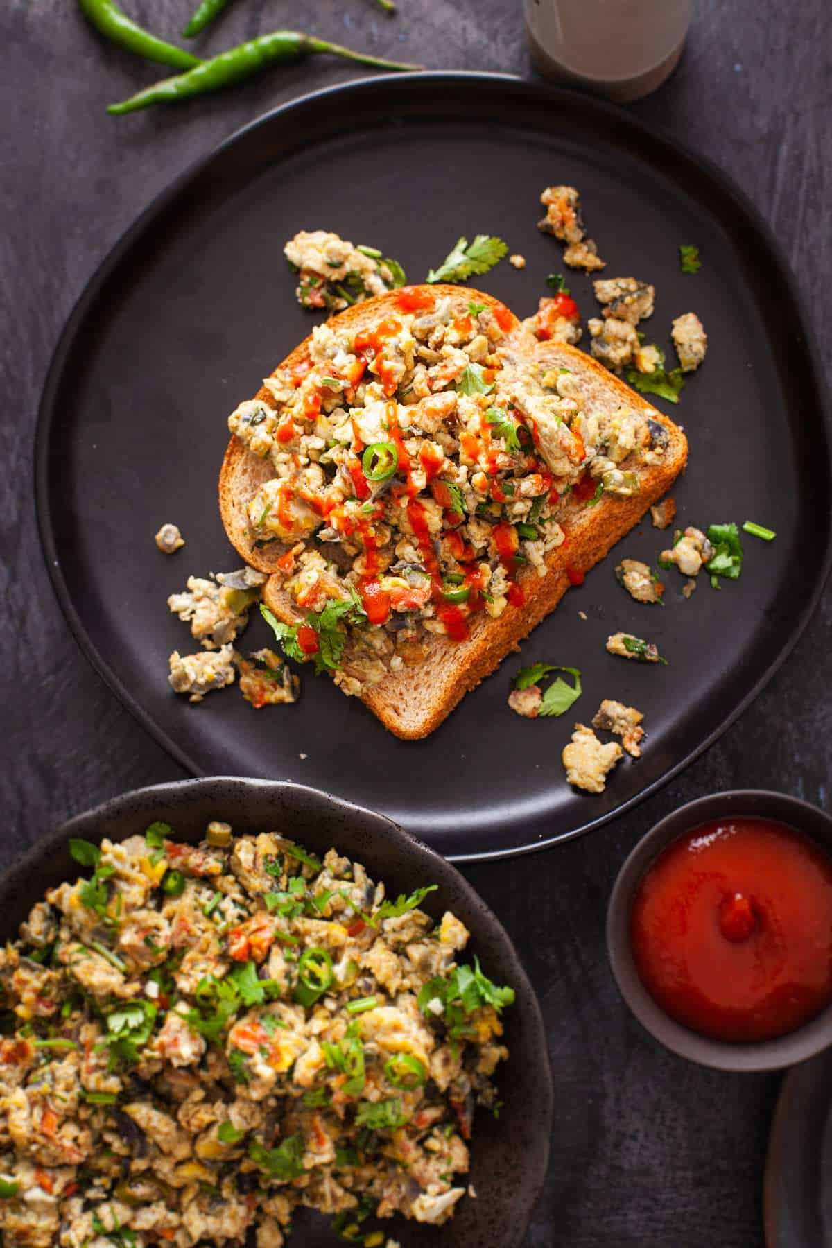 Egg Bhurji sourdough toast with dashed of hot sauce.