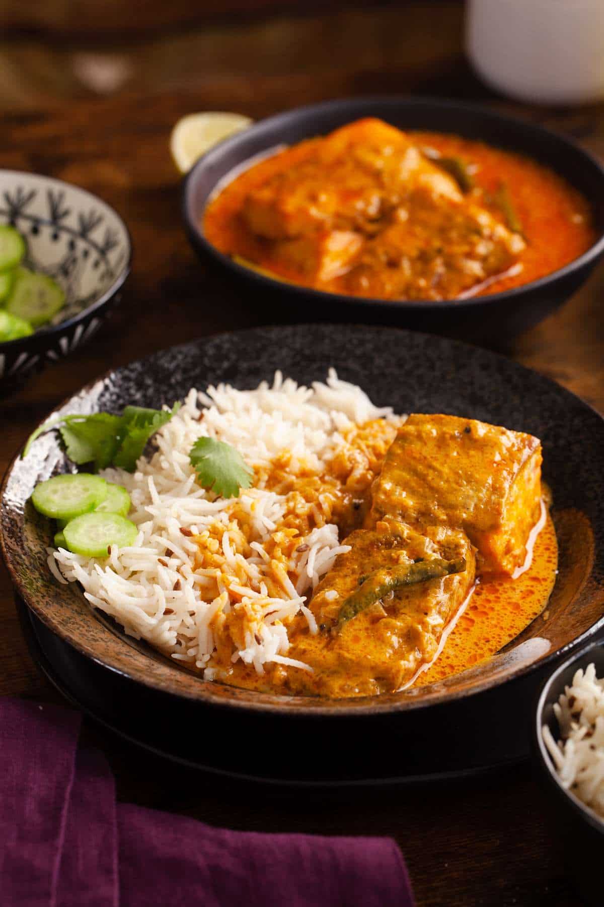 Coconut nut milk salmon curry served with steamed basmati rice and cucumber slices. 