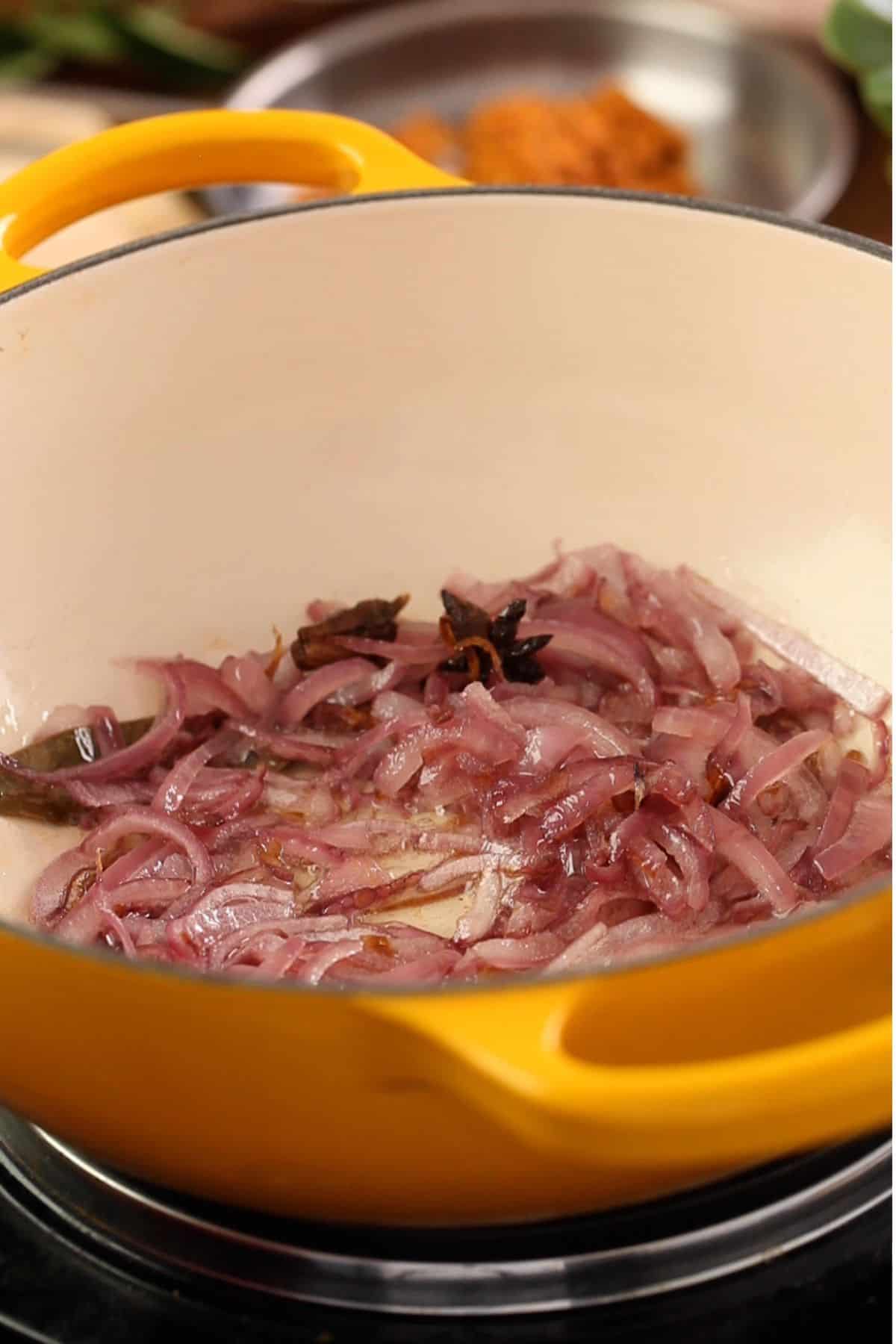 Onion and whole spices are browned in oil.