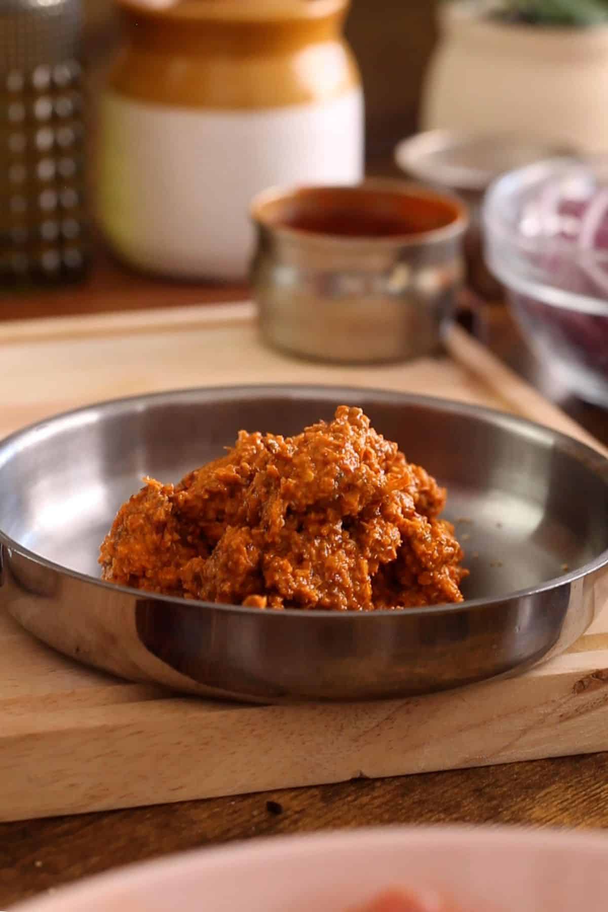 Homemade chettinad masala in a steel plate.