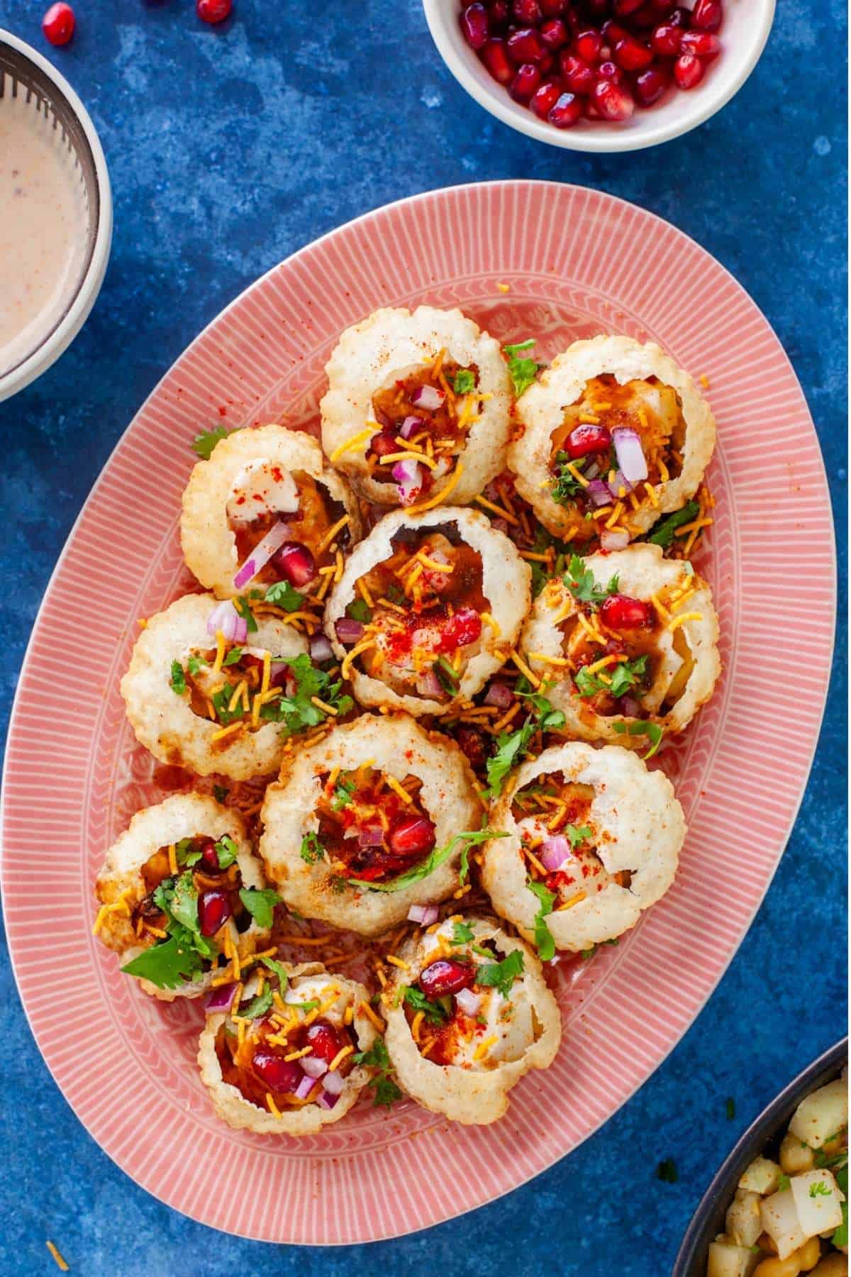Dahi Puri Platter placed on a blue background.