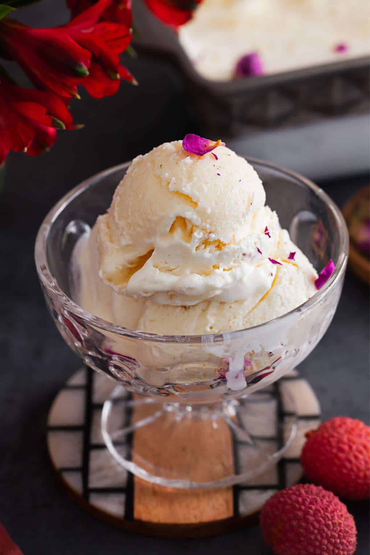 Close up of litchi ice cream with rose petal garnish. 