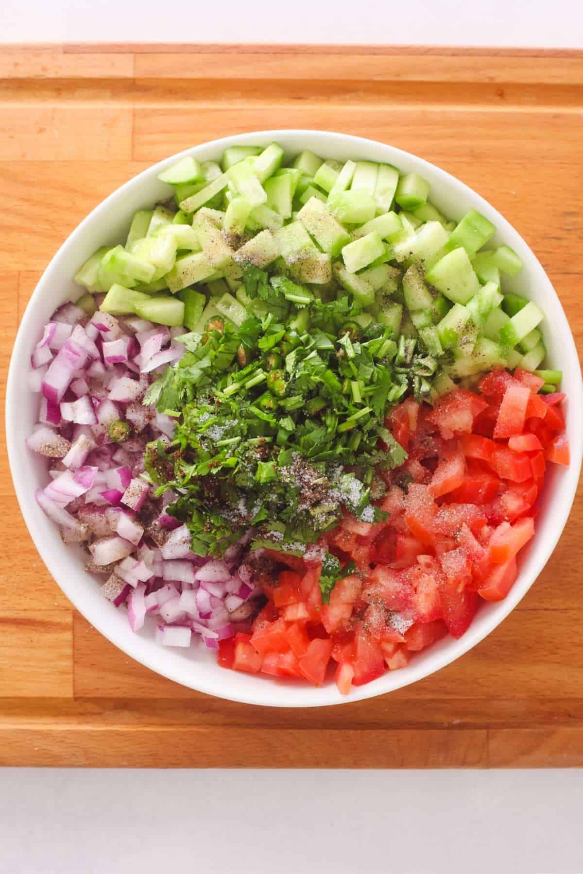 Making indian chopped salad. 