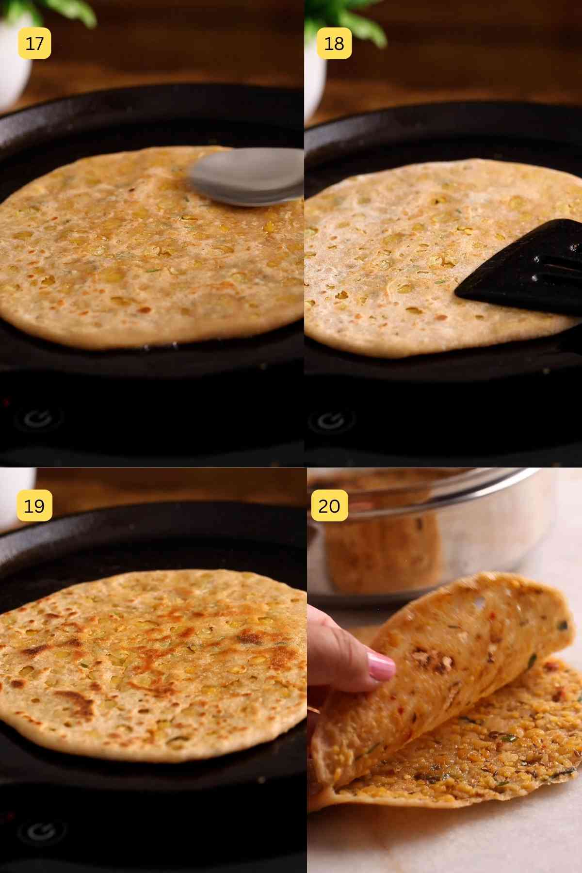 Cooking chana dal paratha on an iron griddle.