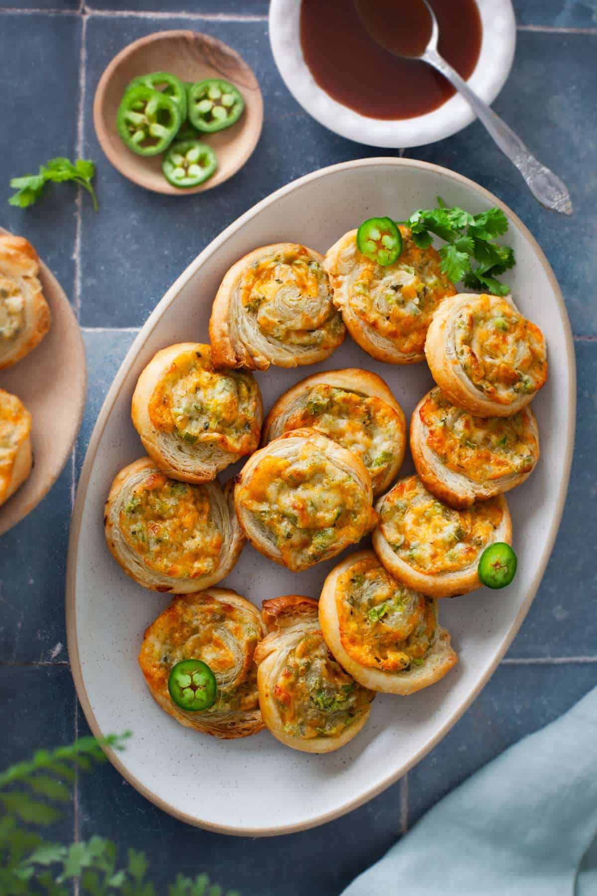 Jalapeno Pinwheels palce in an oval platter with chutney.