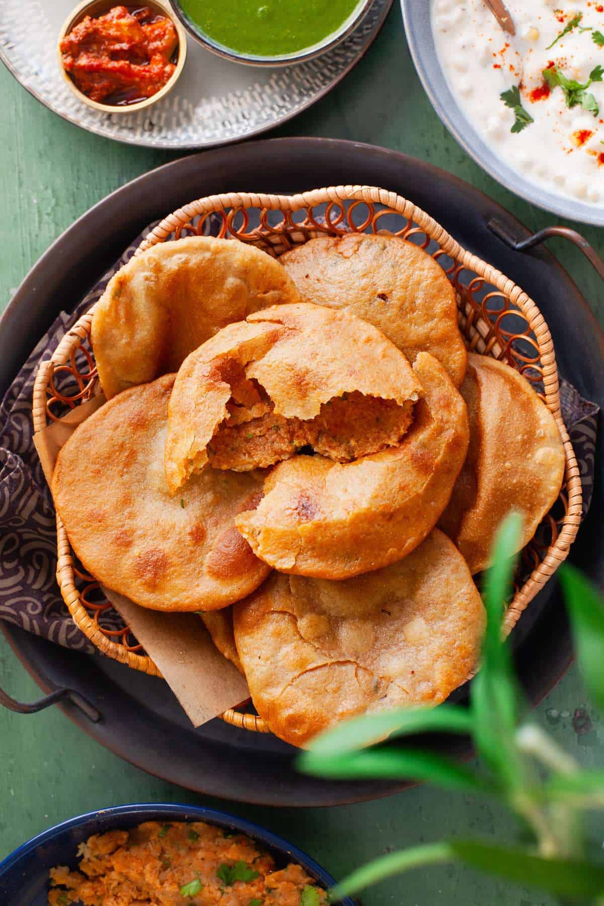Aloo kachori palced in a basket.