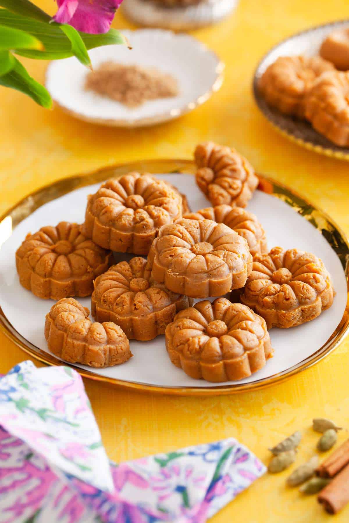 Chai Masala Peda on a white and gold plate.