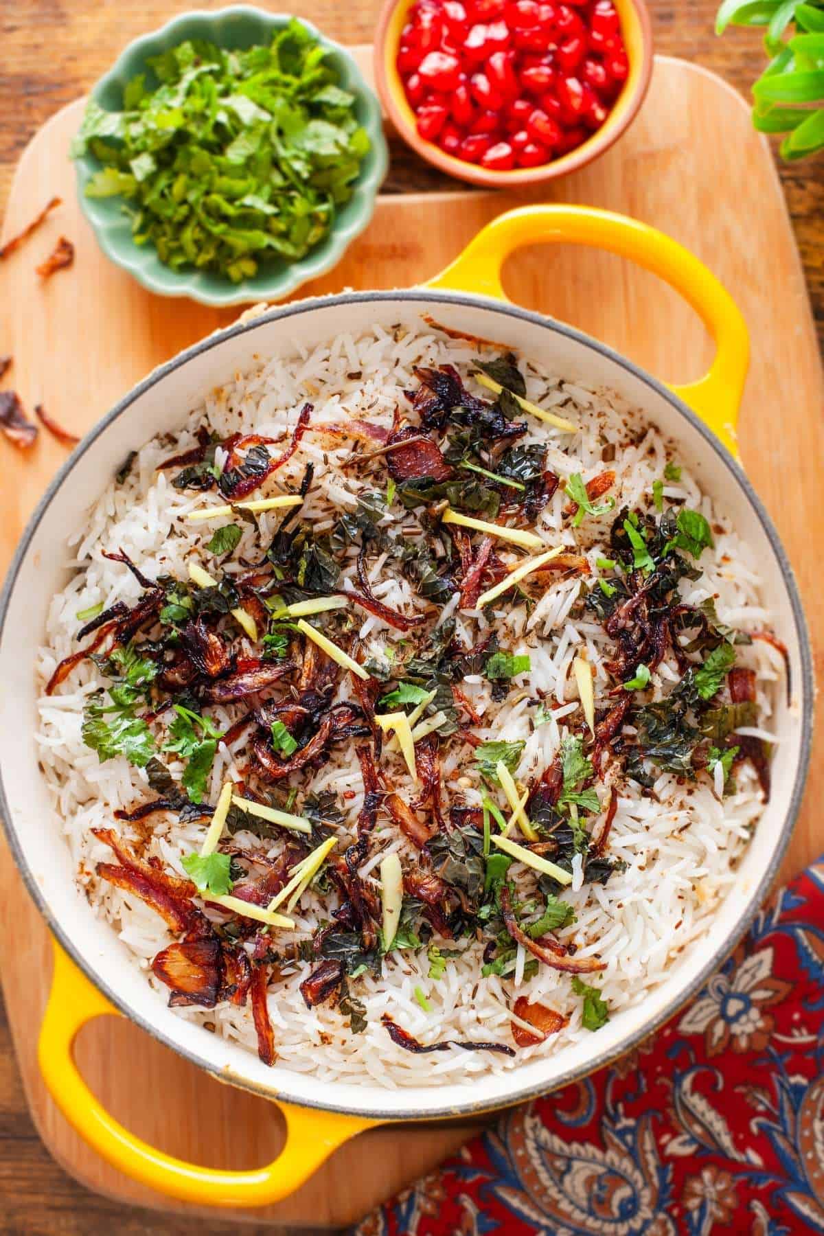 A large pot of dum cooked paneer biryani.