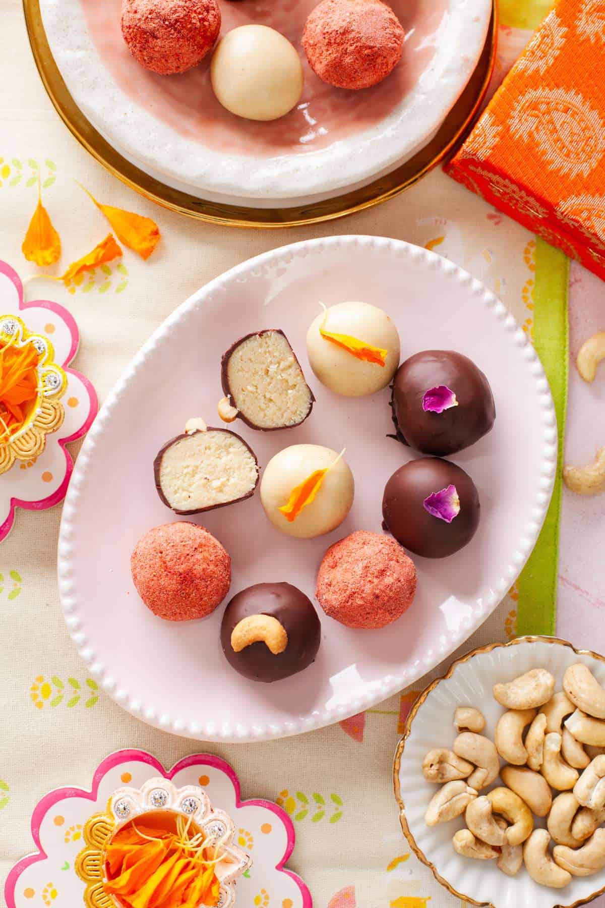 Kaju Katli Truffles placed on a pink plate.