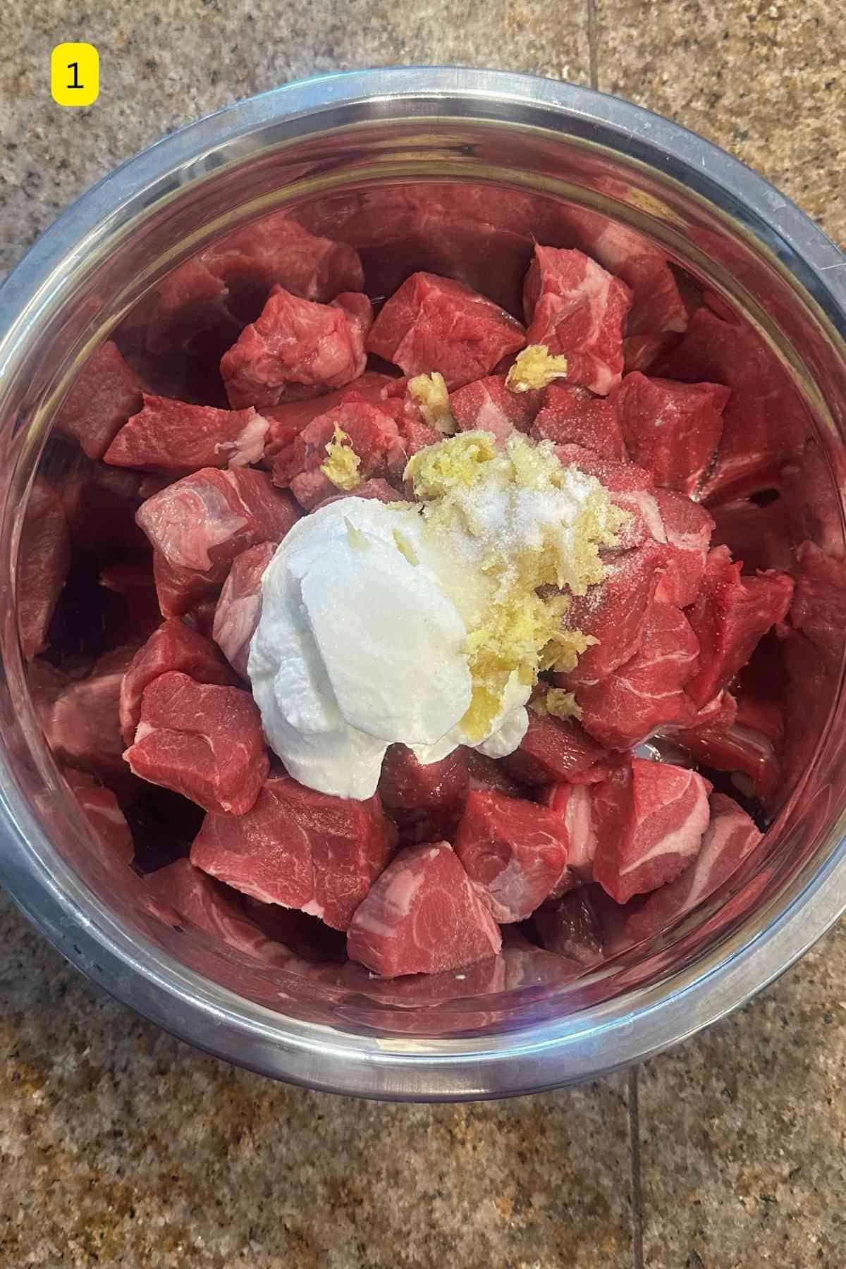 Lamb meat with yogurt, ginger garlic and salt.