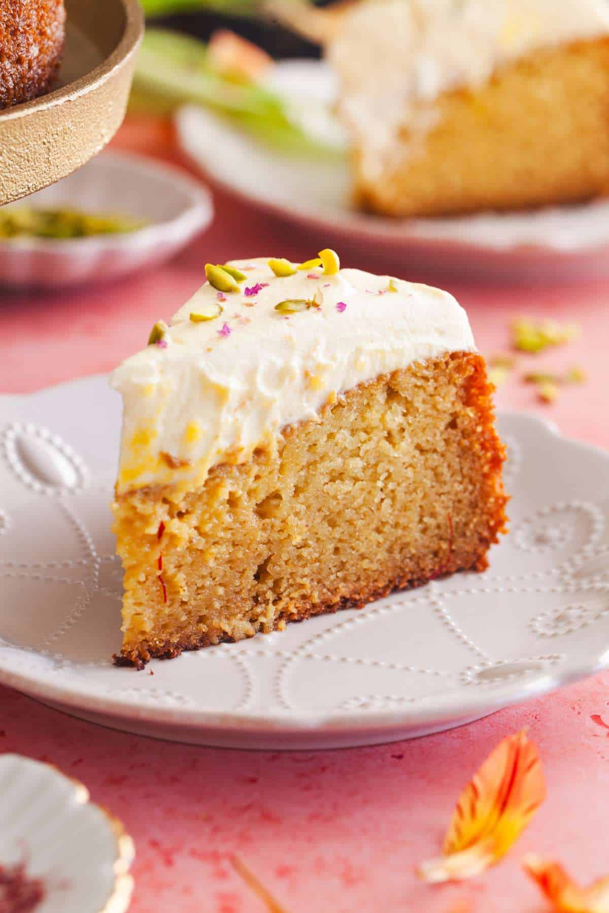 Side view of slice of cake on a white plate.