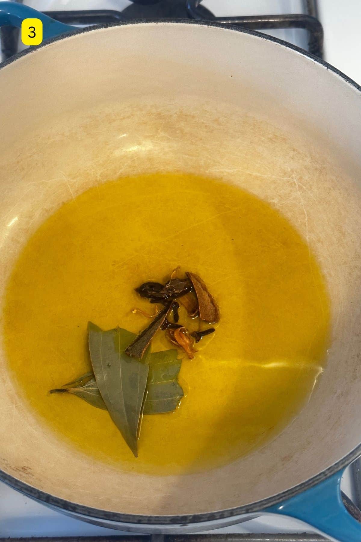 Mustard oil temepred with whole spices.