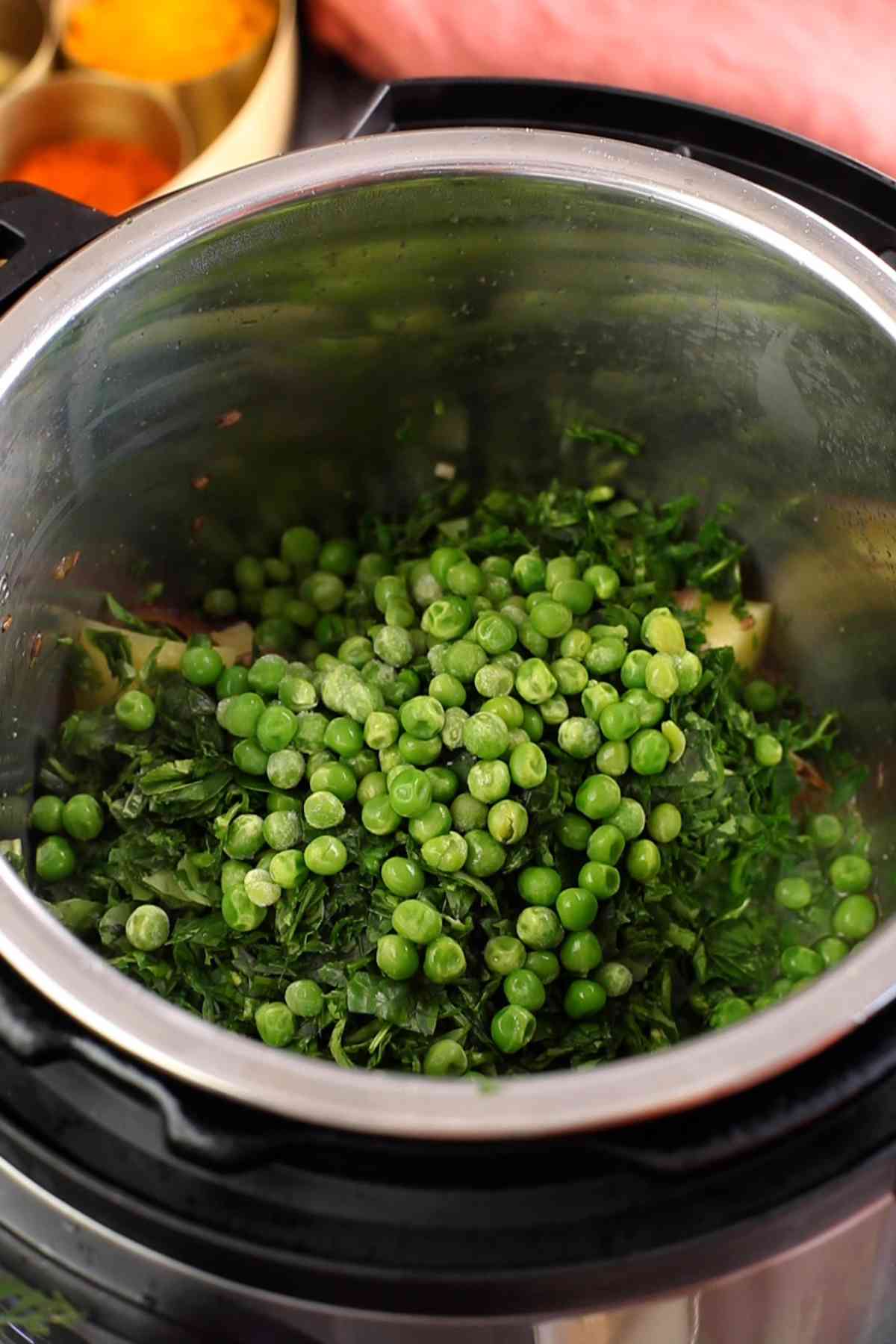 Green peas and chopped methi leaves added to pulao. 