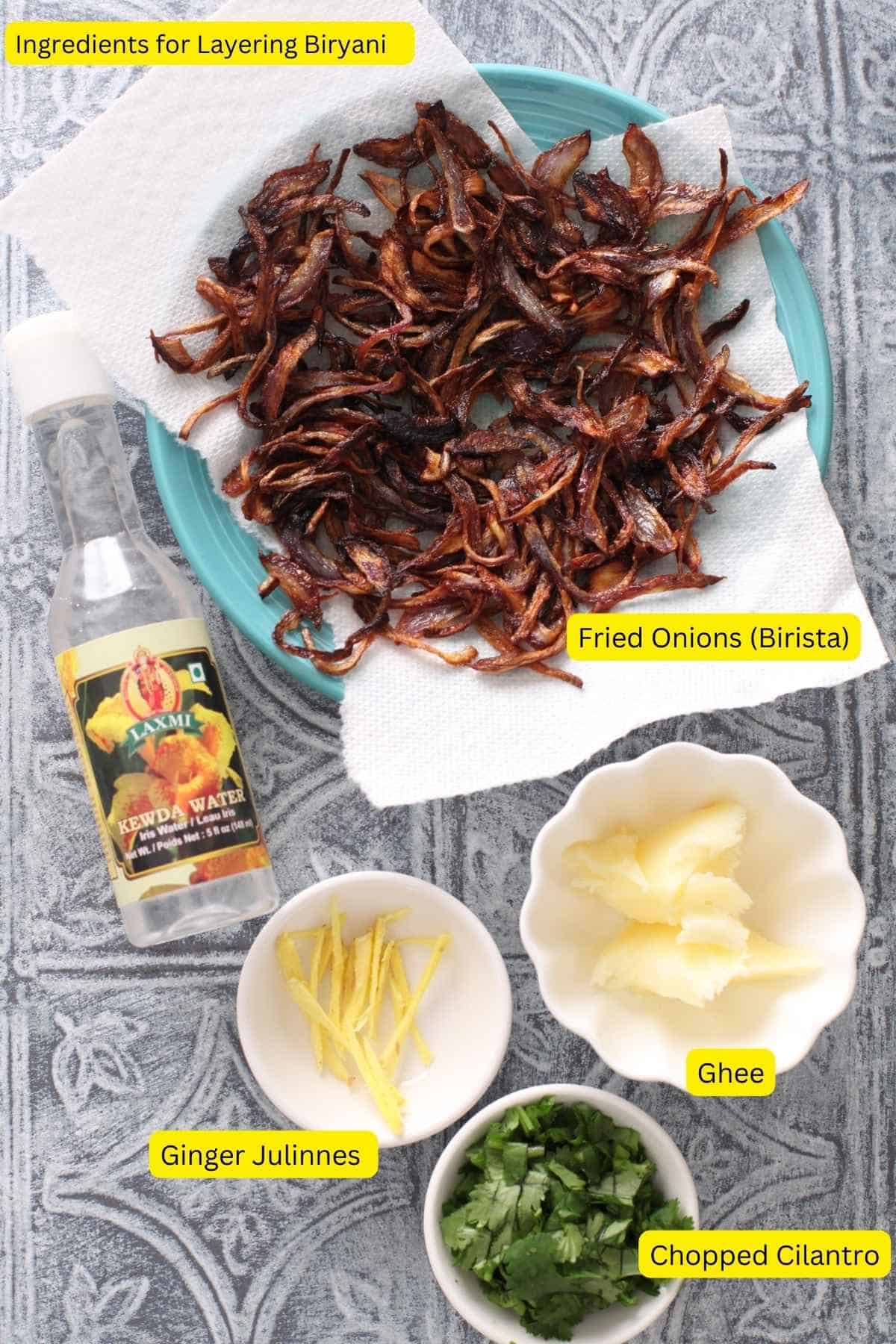 Ingredients needed for layering the mutton biryani.