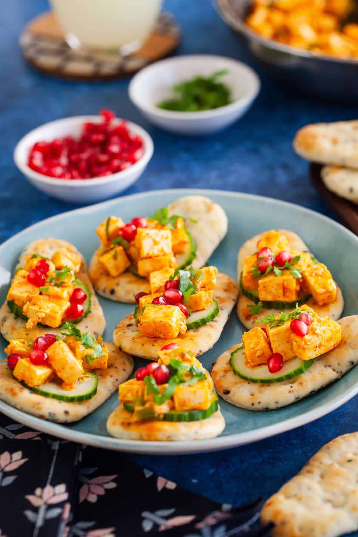 Side view of peri peri paneer naan bites appetizer.