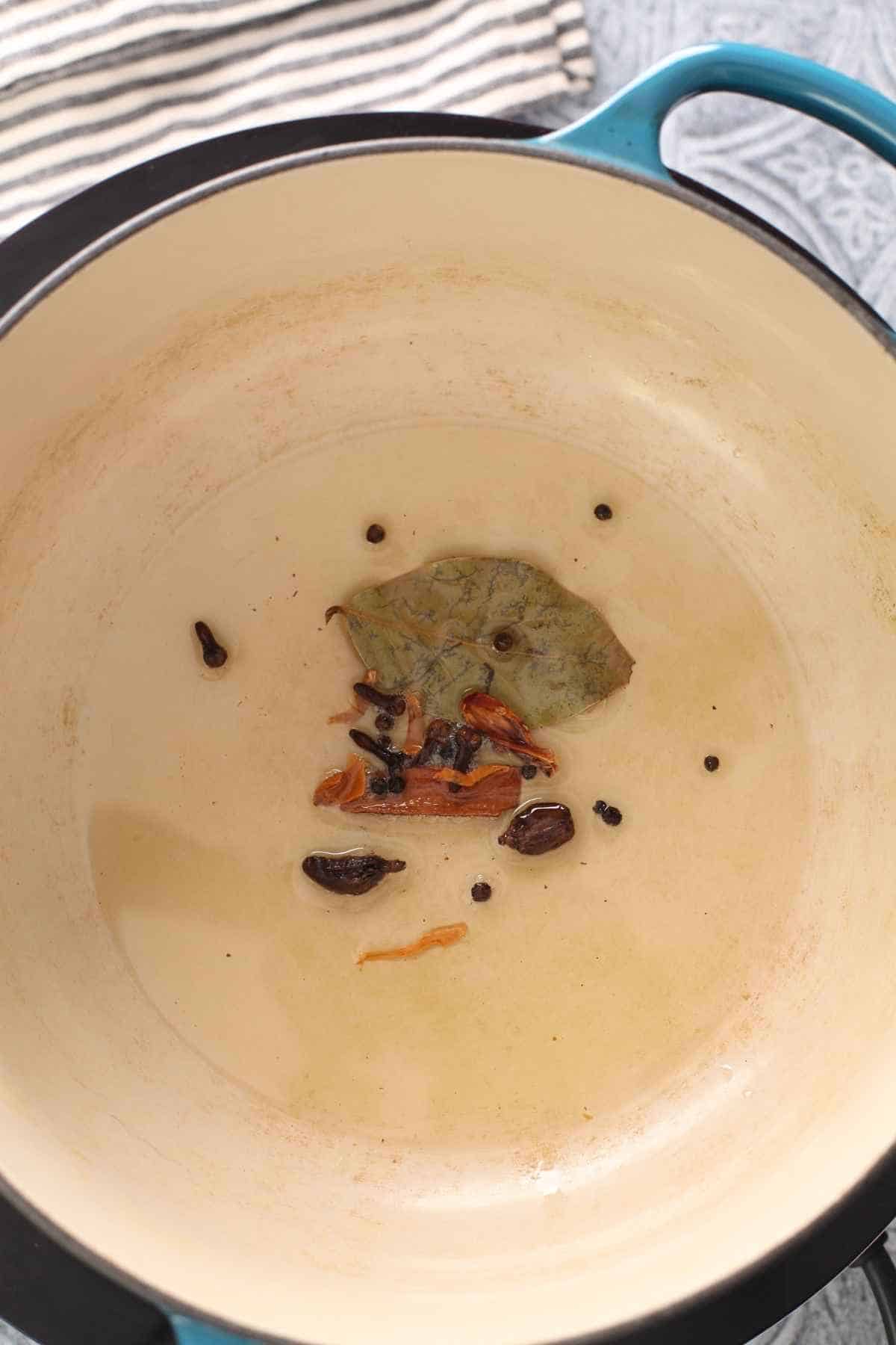 Oil tempered with whole spices.