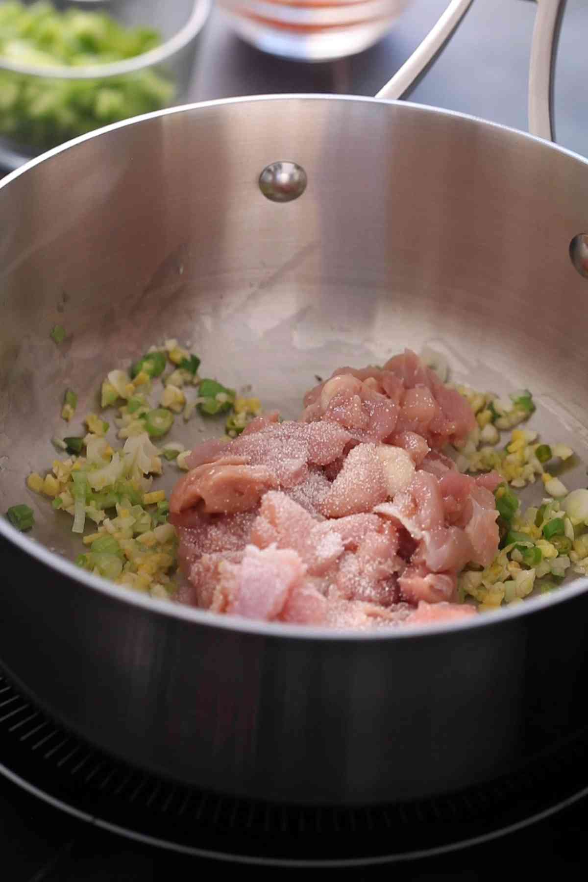 Chicken is added next to the soup base.