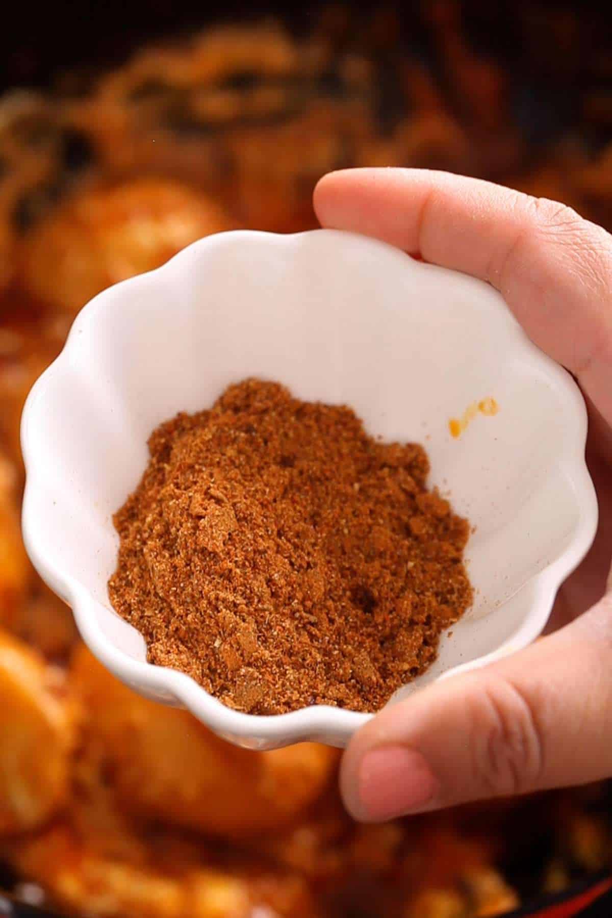 Powdered spices in a white bowl.