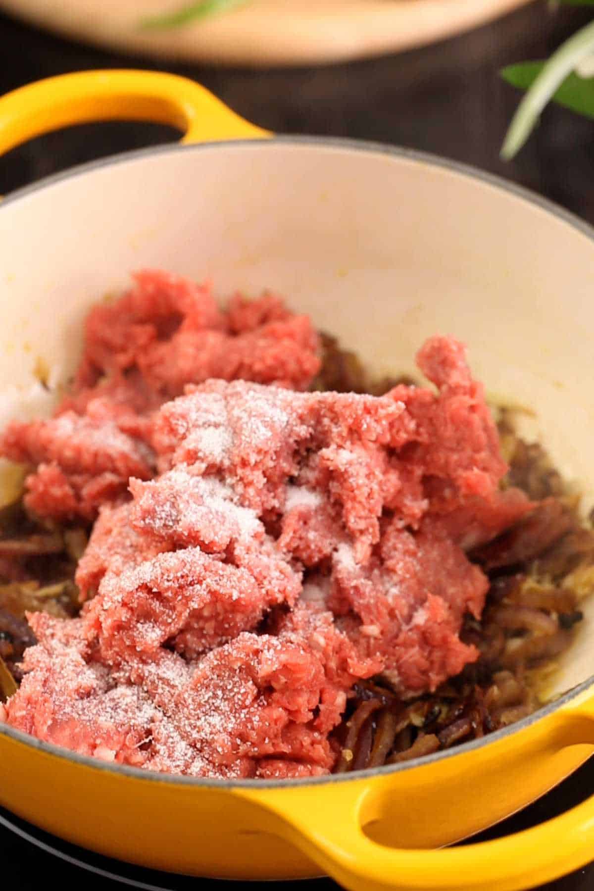 Ground lamb added to the onion mixture. 