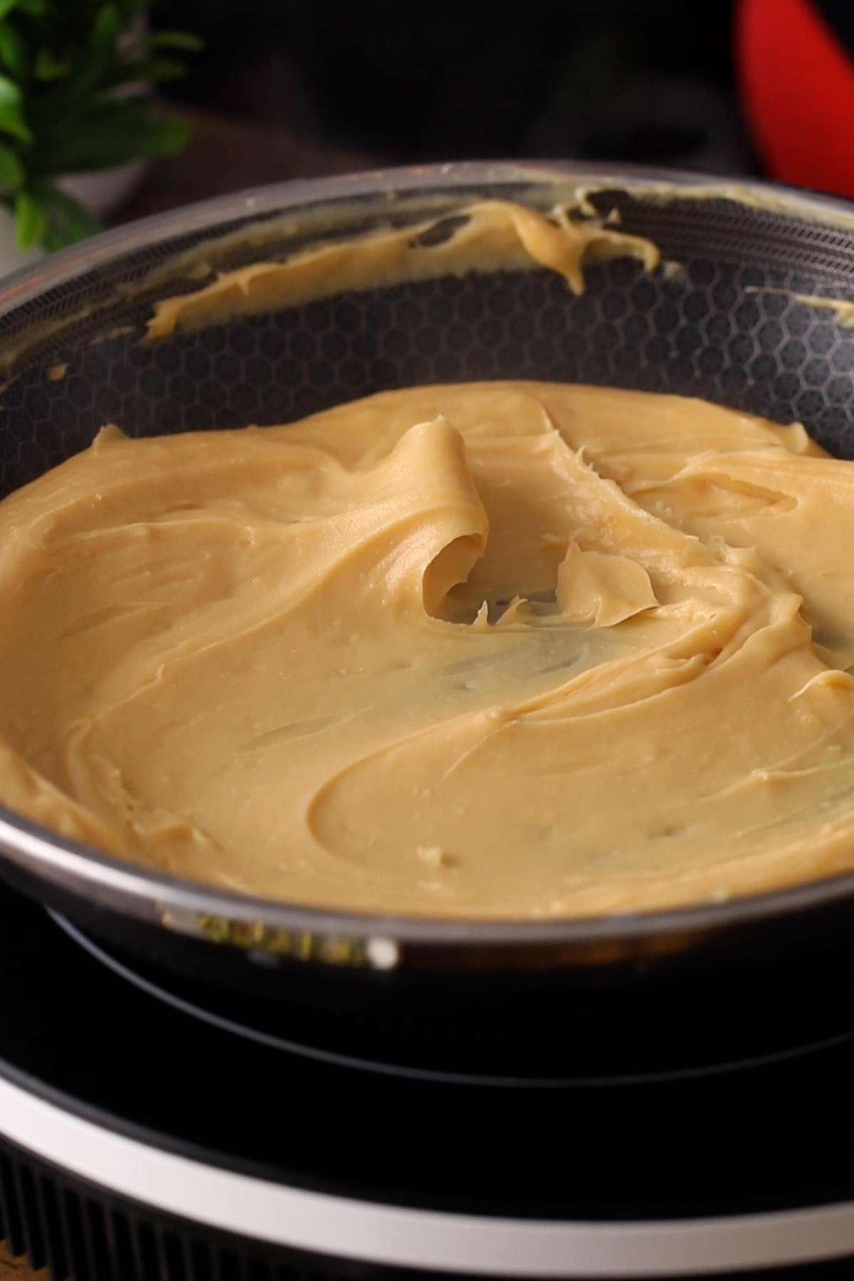 A pale yellow thick halwa mixture is formed.