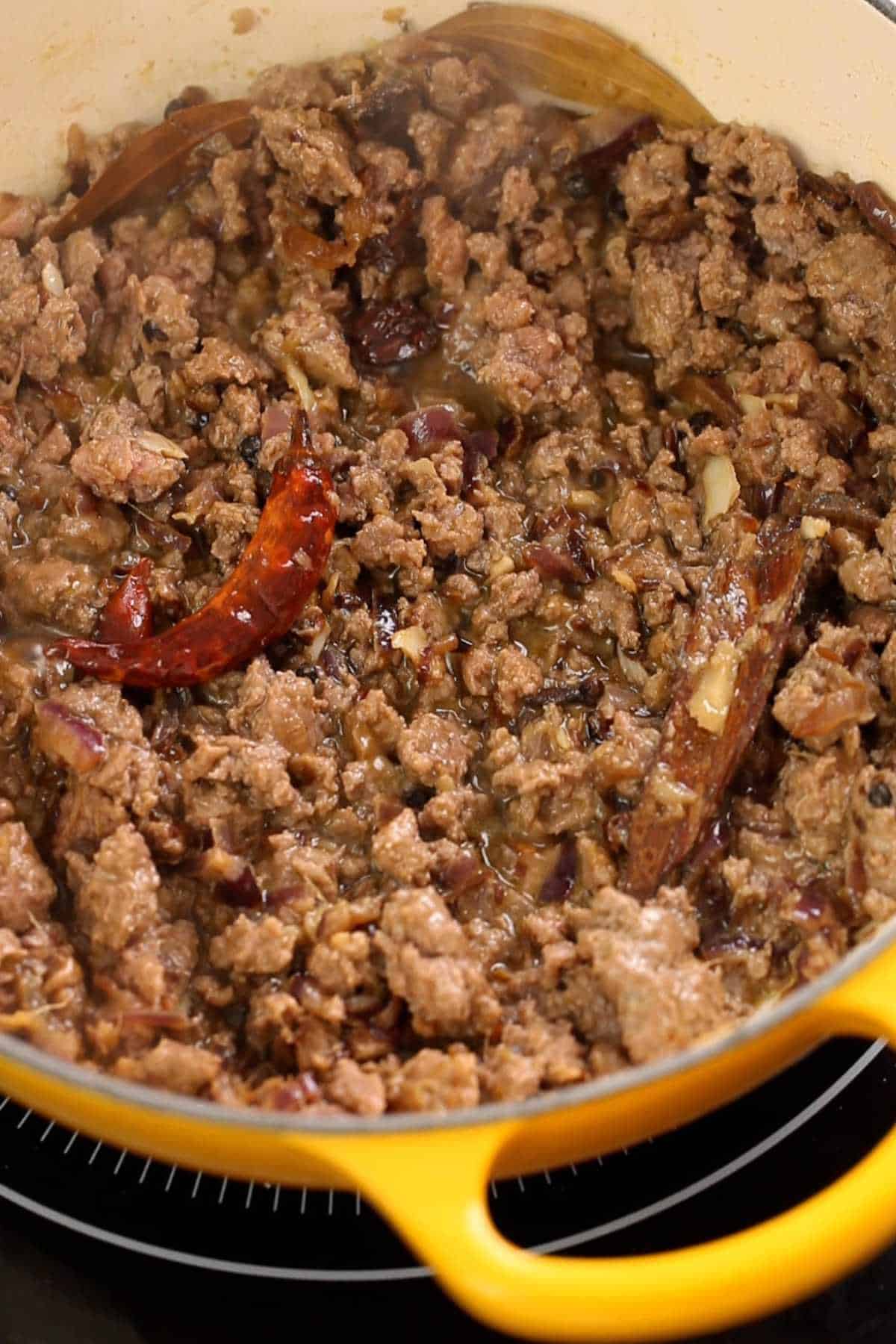 Browned lamb keema in a cooking pot.