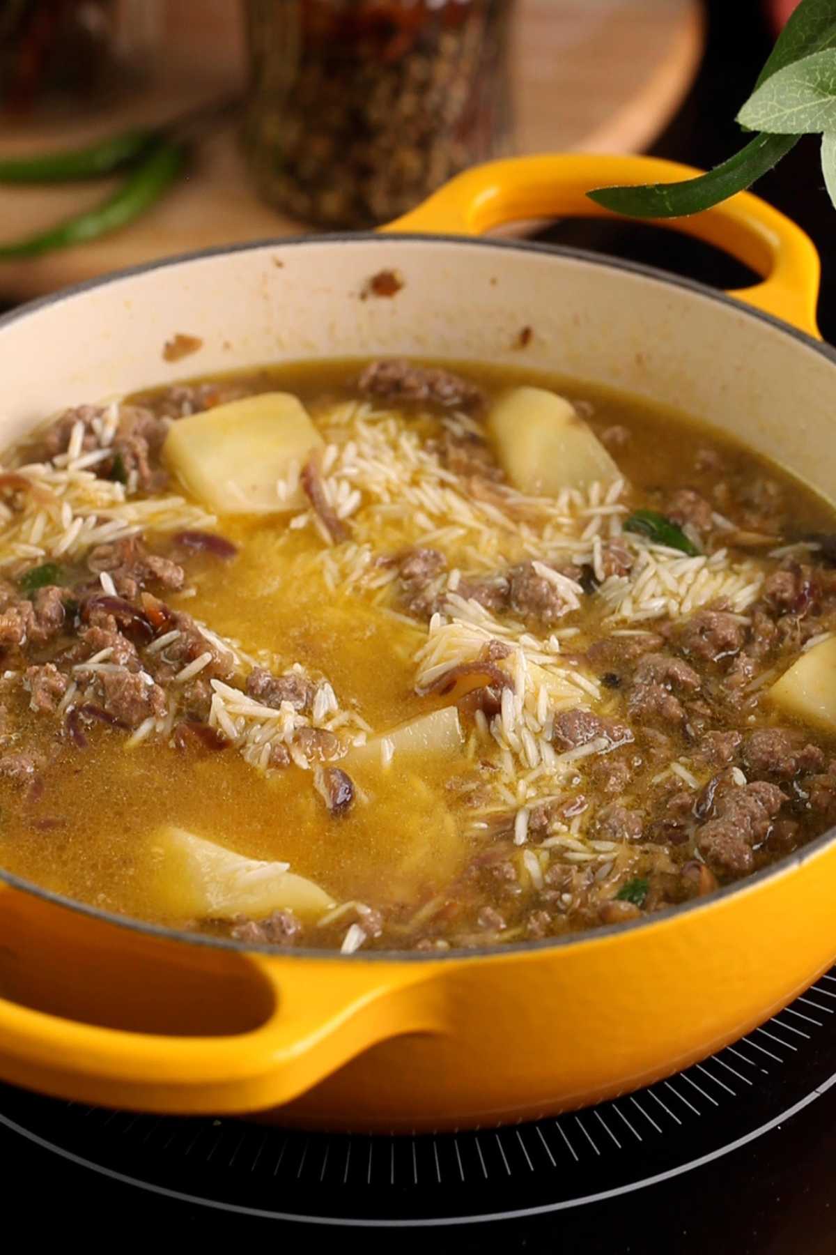 Water is added to cook the keema pulao.