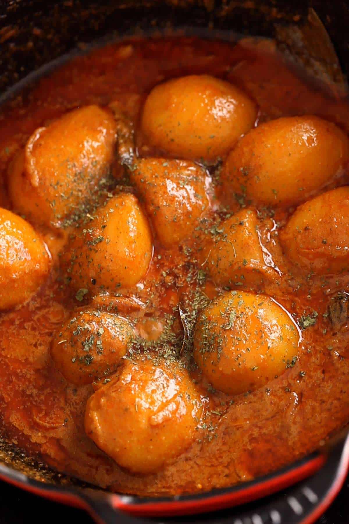 Finishing dum aloo with kasuri methi.