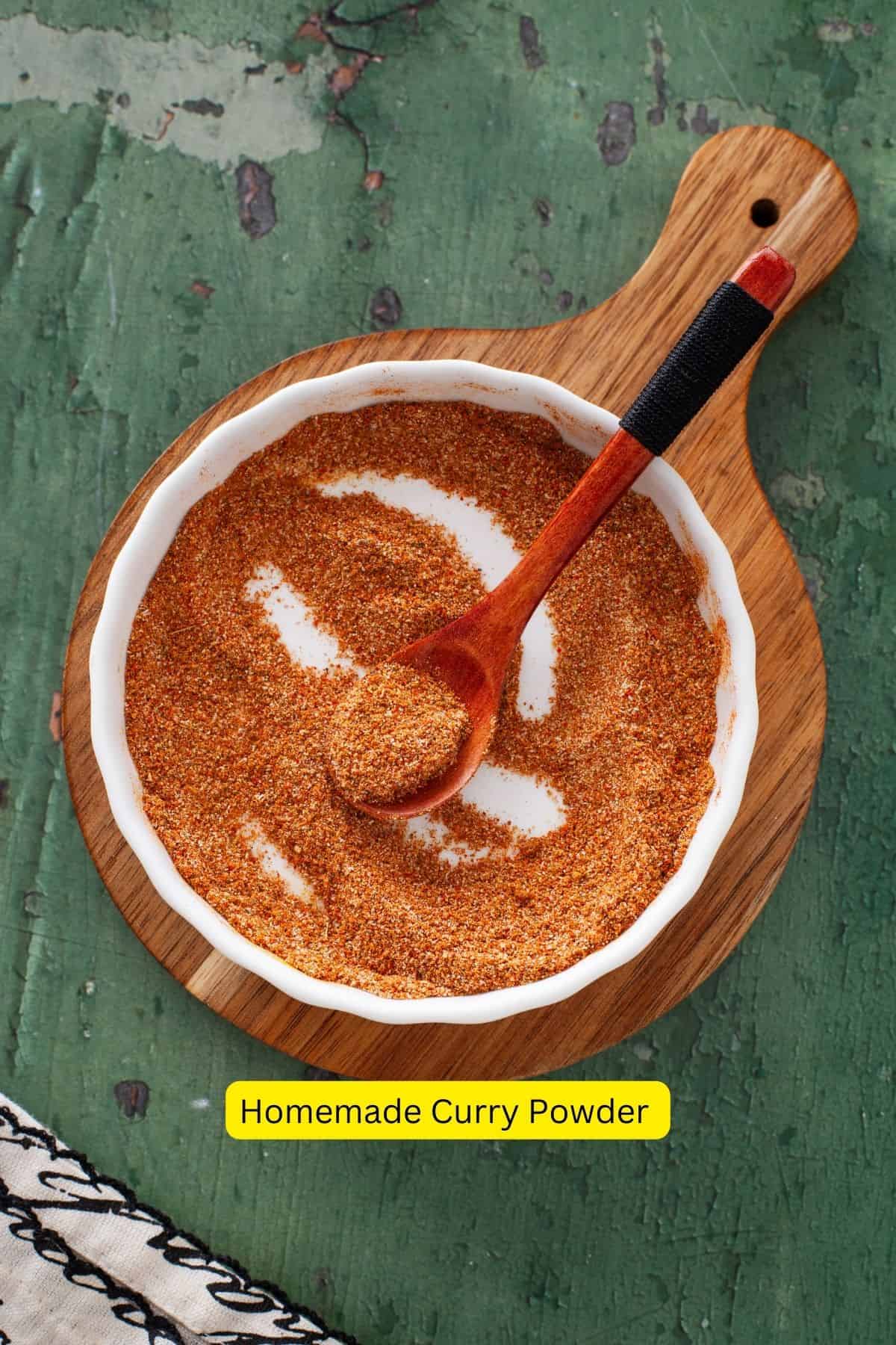 Homemade curry spice blend in a white shallow dish.