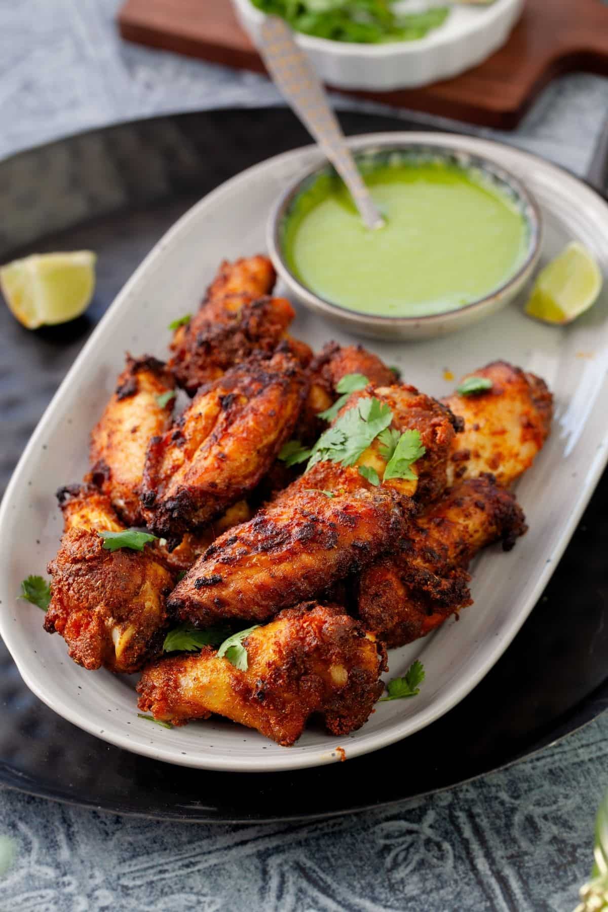 Indian style chicken curry wings served with chutney.