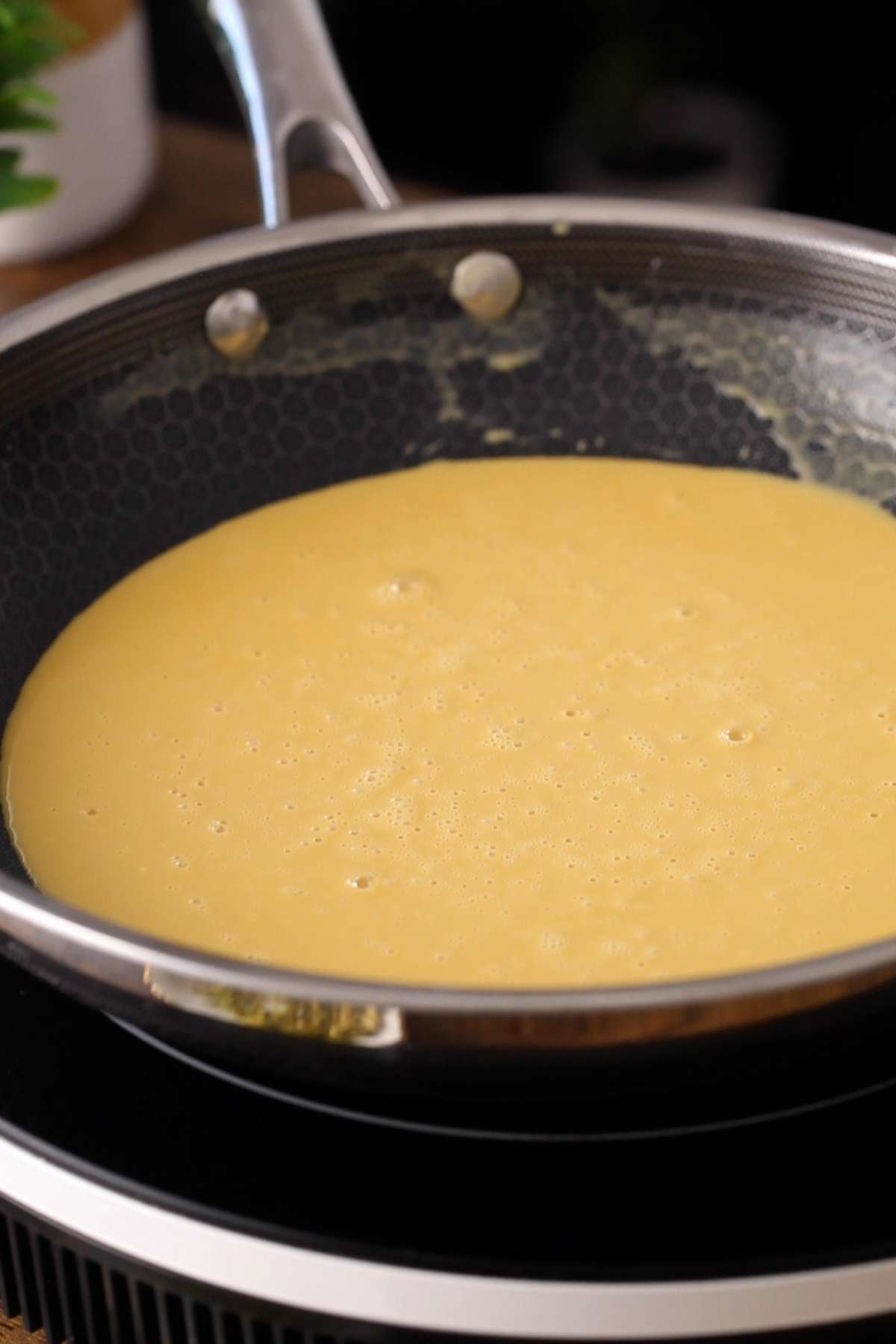 Roasting besan in ghee while stirring.