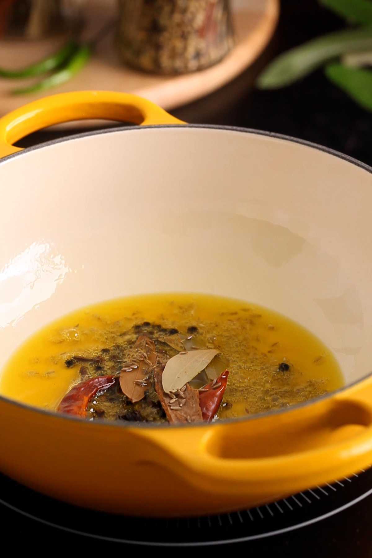 Tempering Oil with whole spices.