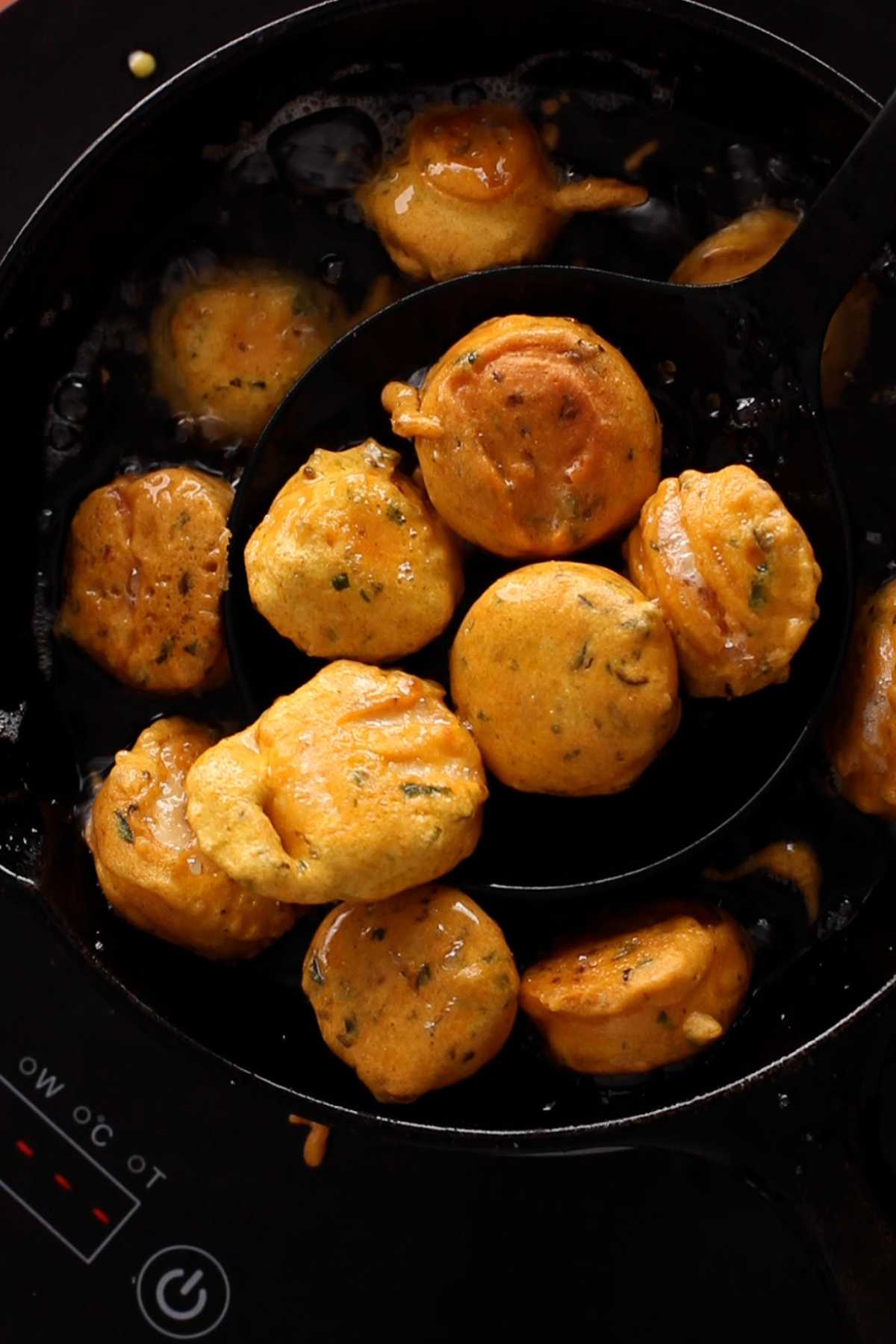 Golden deep fried egg bonda.