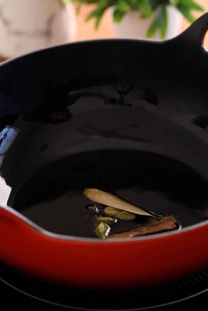 Hot oil tempered with whole spices.