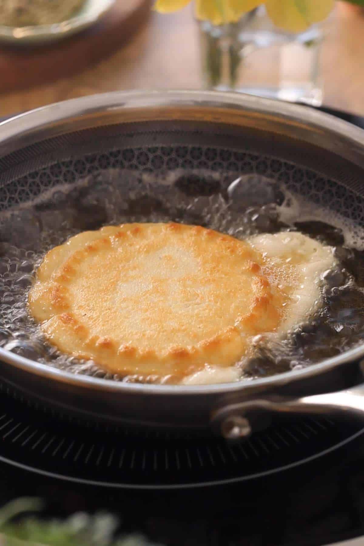Image showing a problem while making malpua that the pancake batter can run out while flipping.