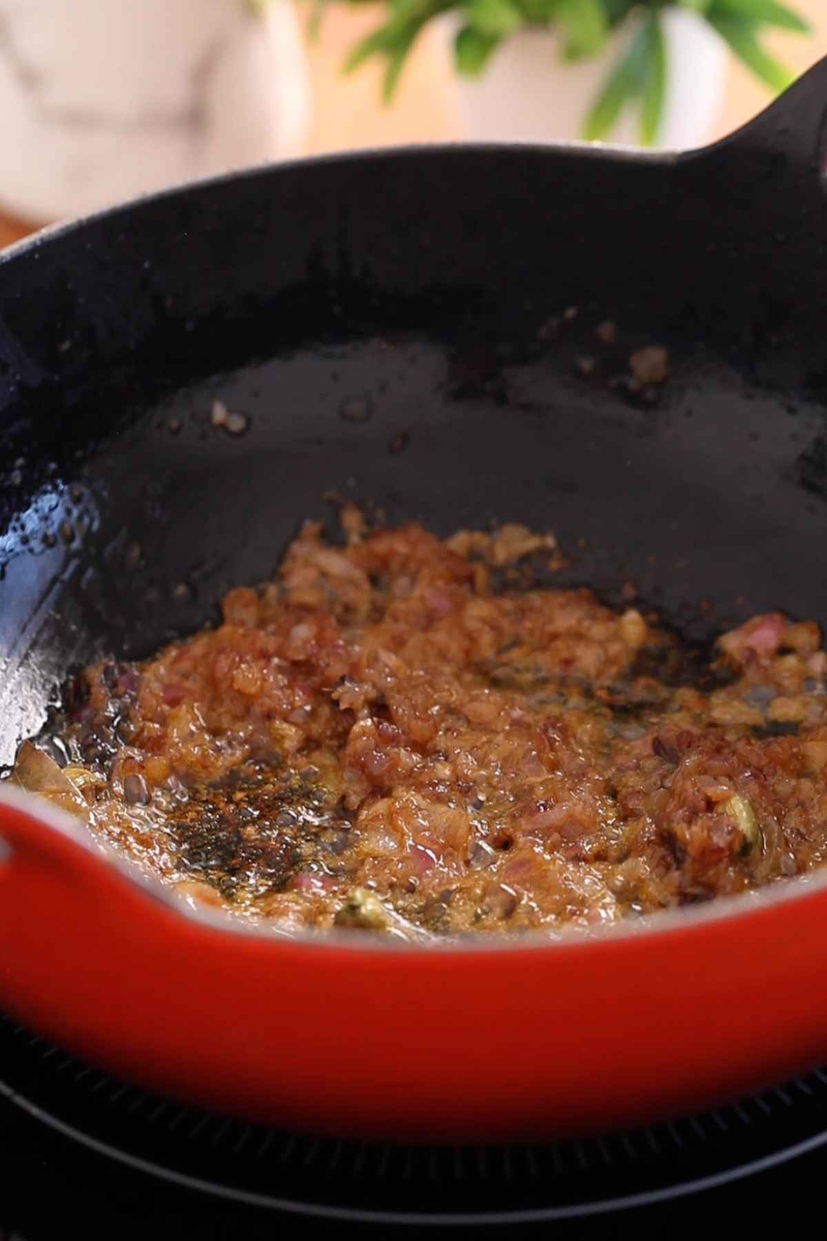 Browned onions in cooking pot.
