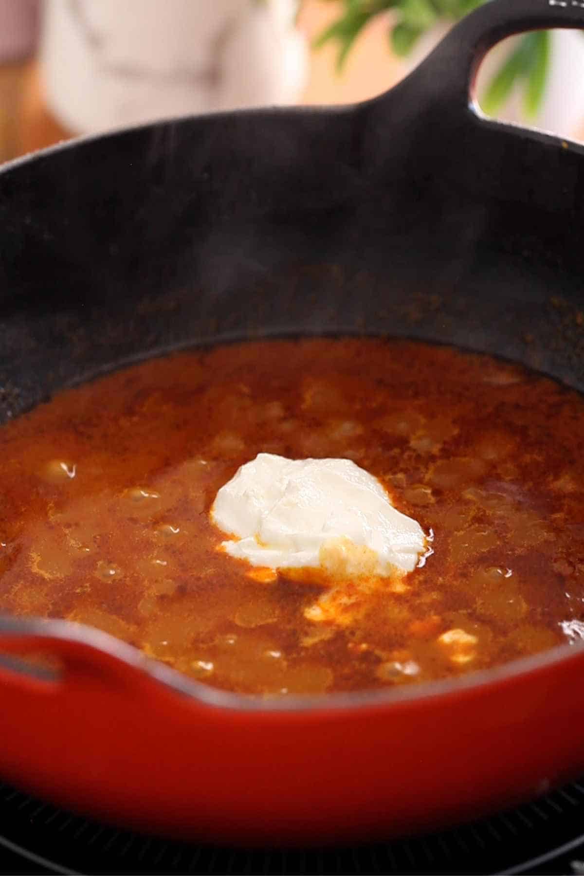 Add in the yogurt to the kofta masala base.