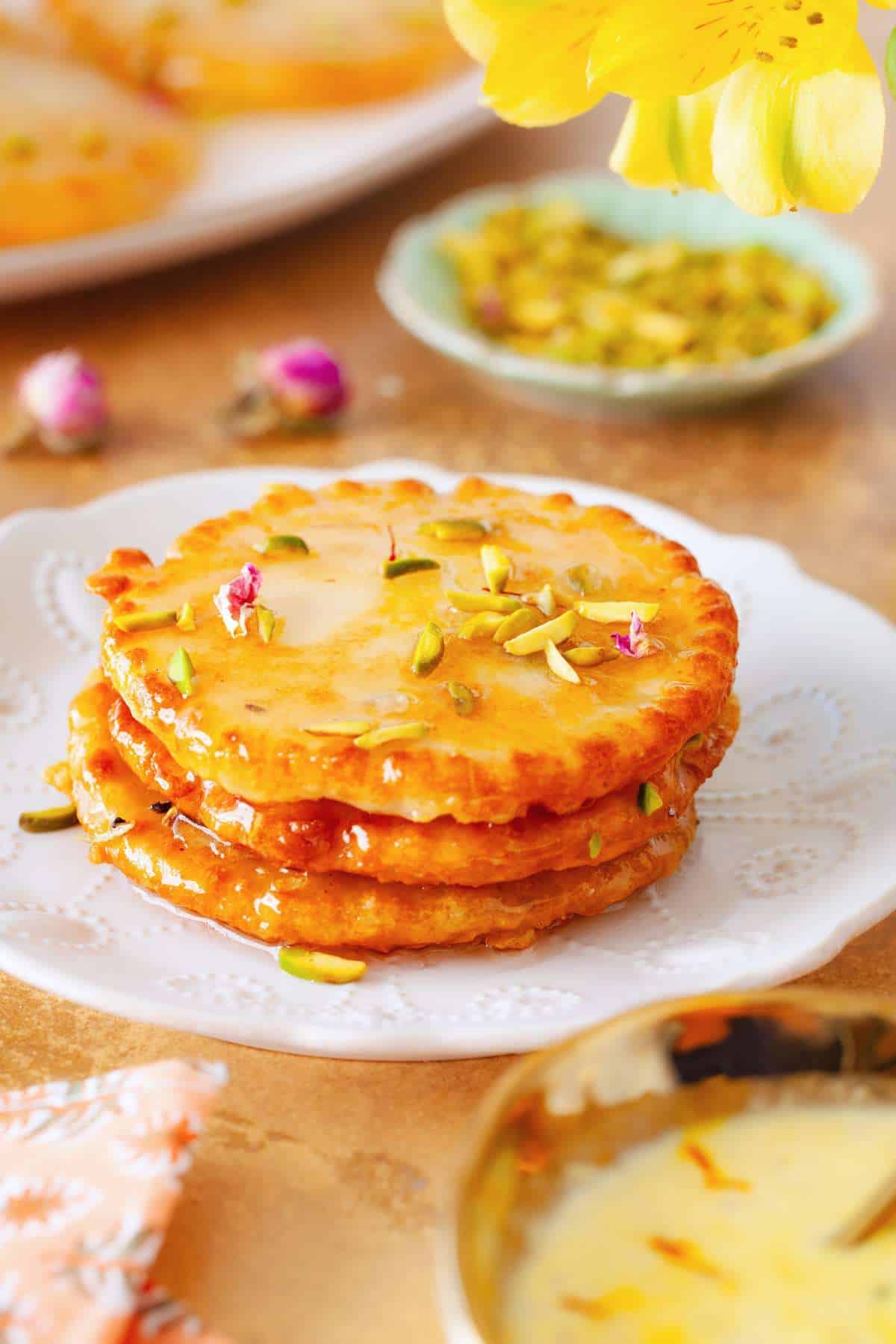 Stack on indian style pancakes in a white lace plate.