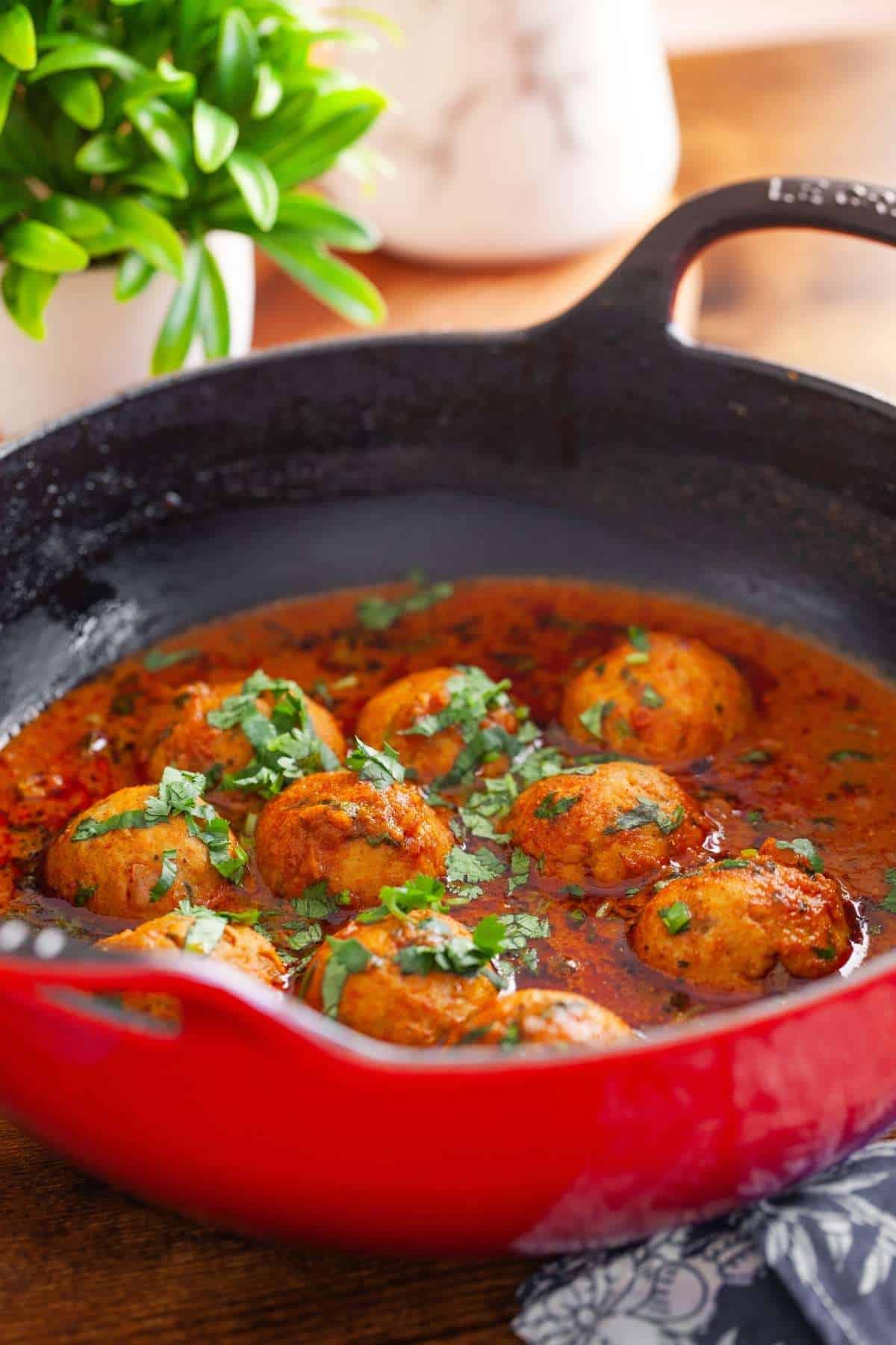 Chicken Kofta Curry served in a cast iron balti dish. 