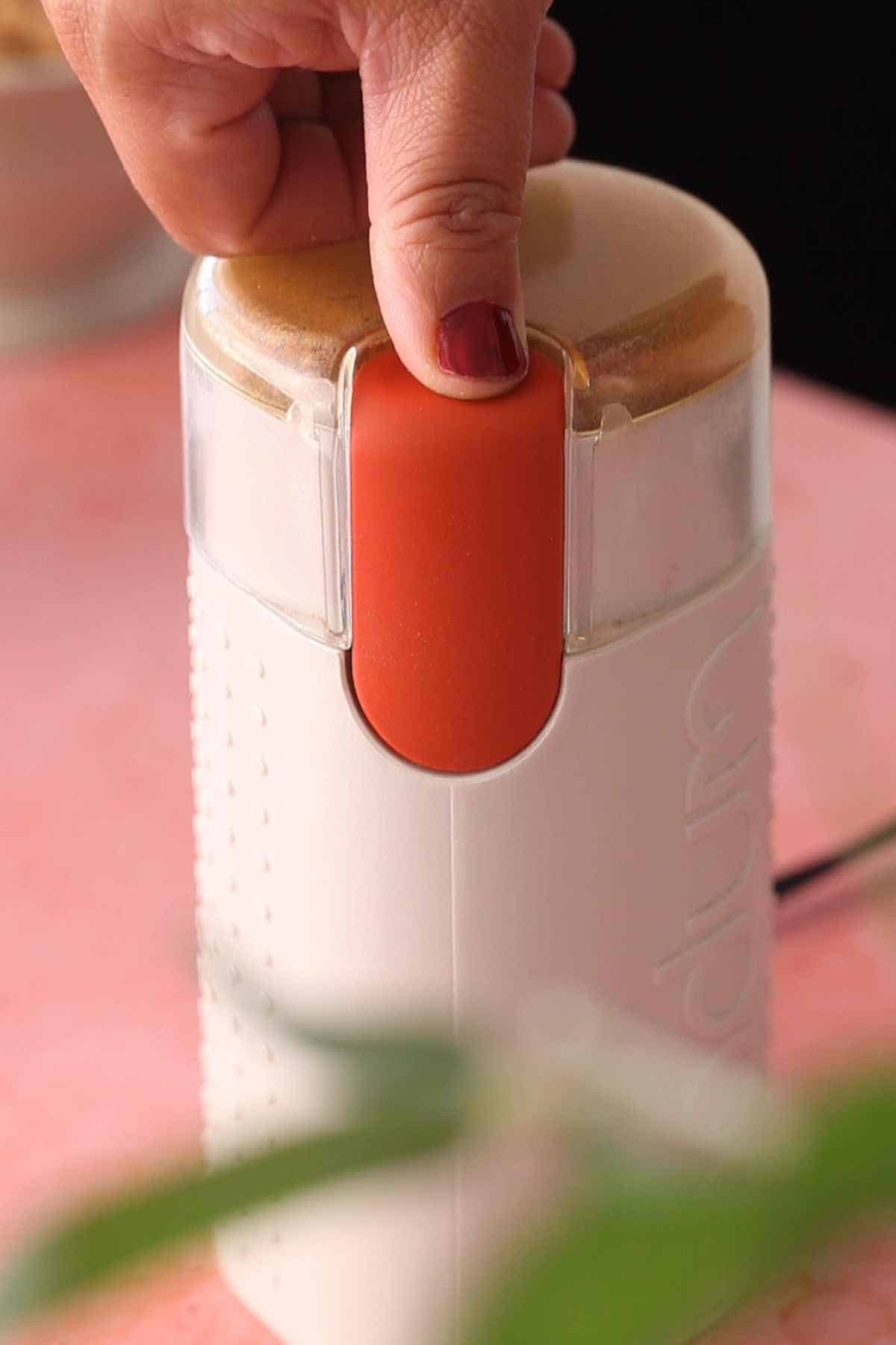 Grinding roasted spices for chana masala.