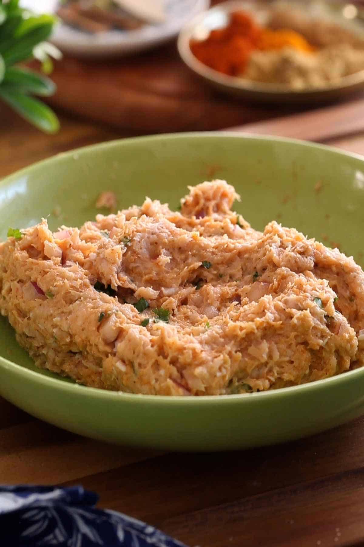 Ground chicken mixture for making chicken kofta meatballs.